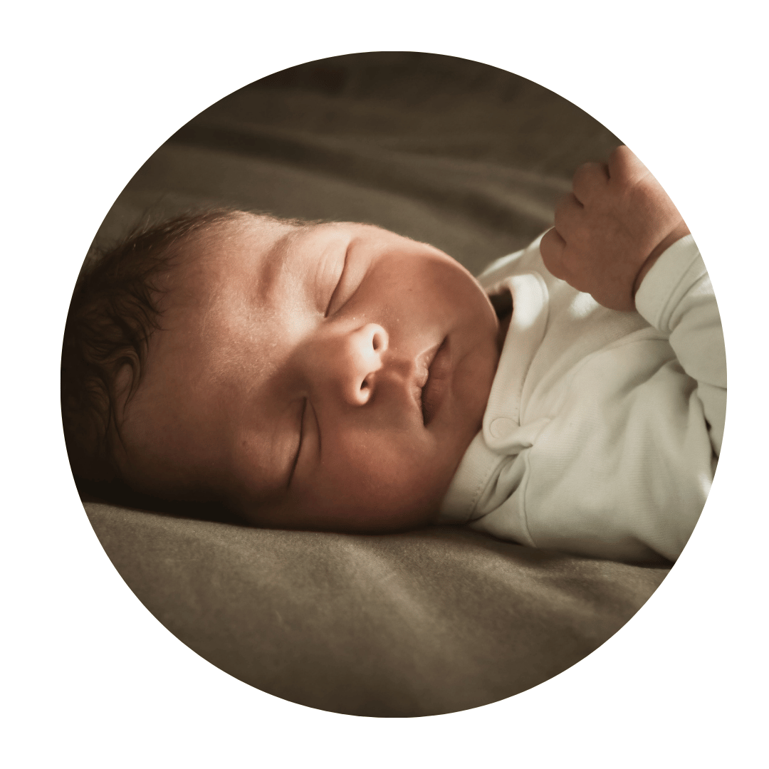 A peaceful newborn baby resting comfortably after receiving expert postpartum care and infant support from Ale la Doula.