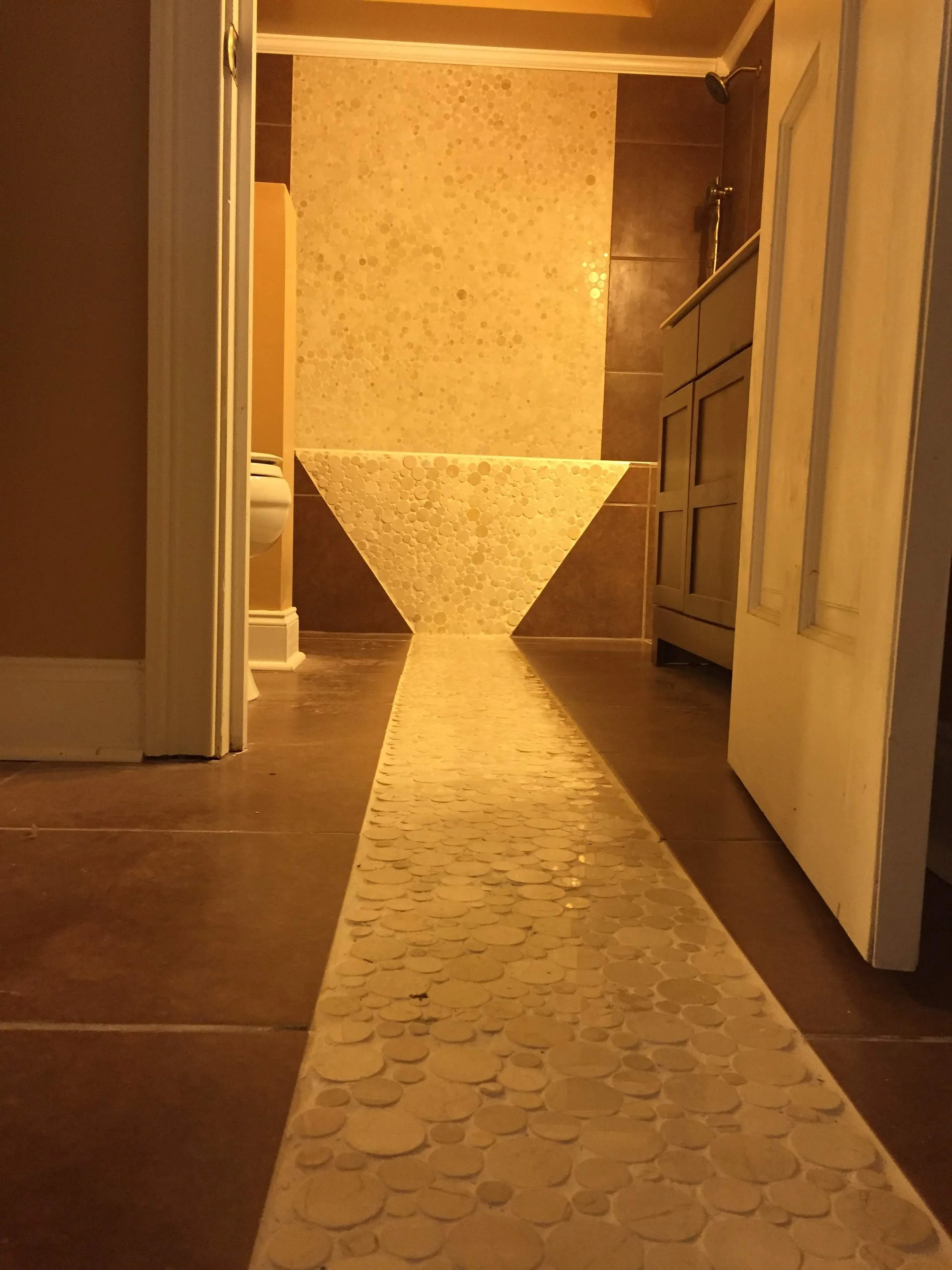custom tiled floor and walls. leading to a great looking tub/ shower great design Fayetteville Ga.