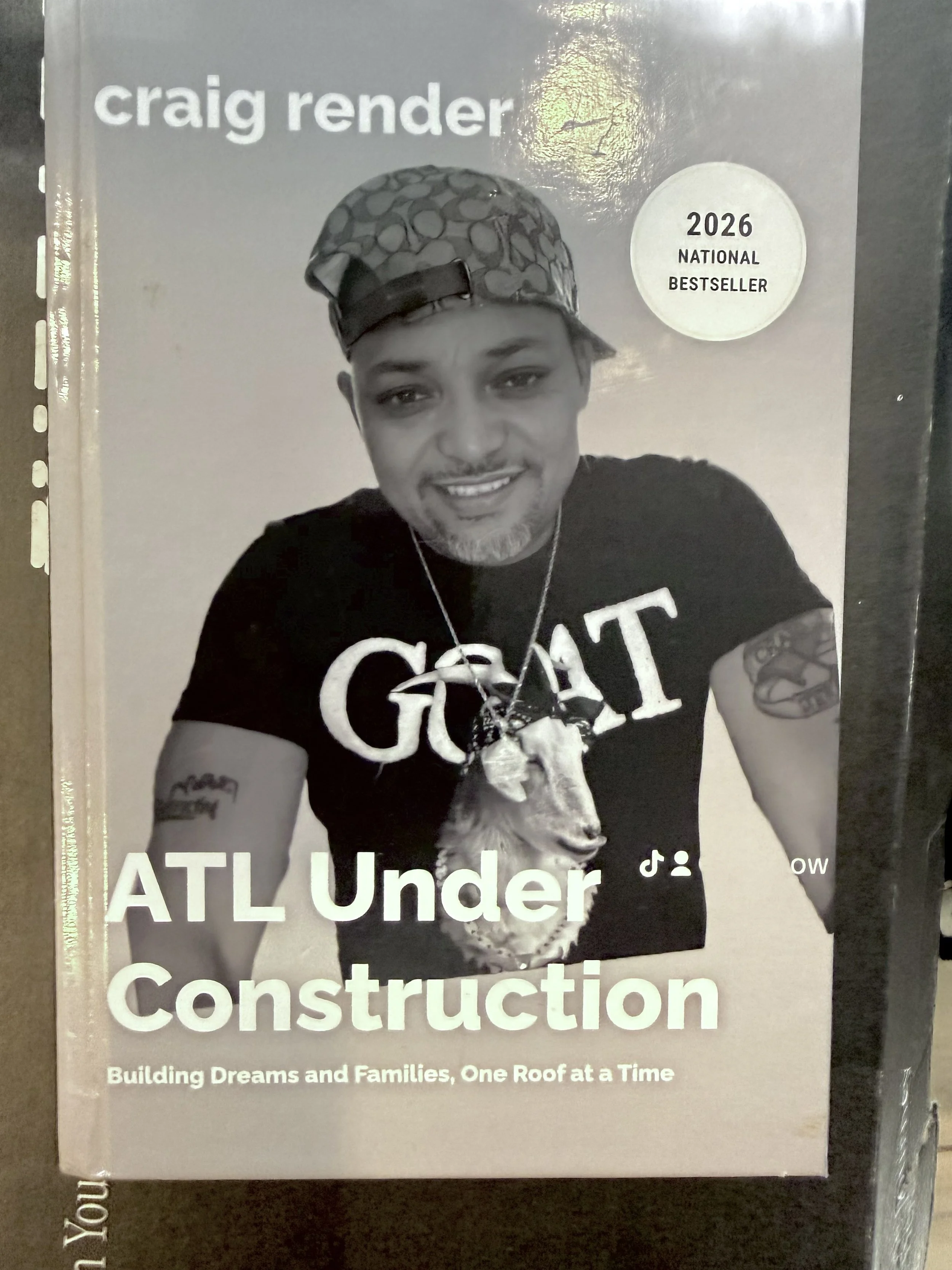 Book cover of 'ATL Under Construction' by Craig Render, featuring a black and white photograph of Craig Render, with text indicating it was a 2026 national bestseller, and a tagline 'Building Dreams and Families, One Roof at a Time'.