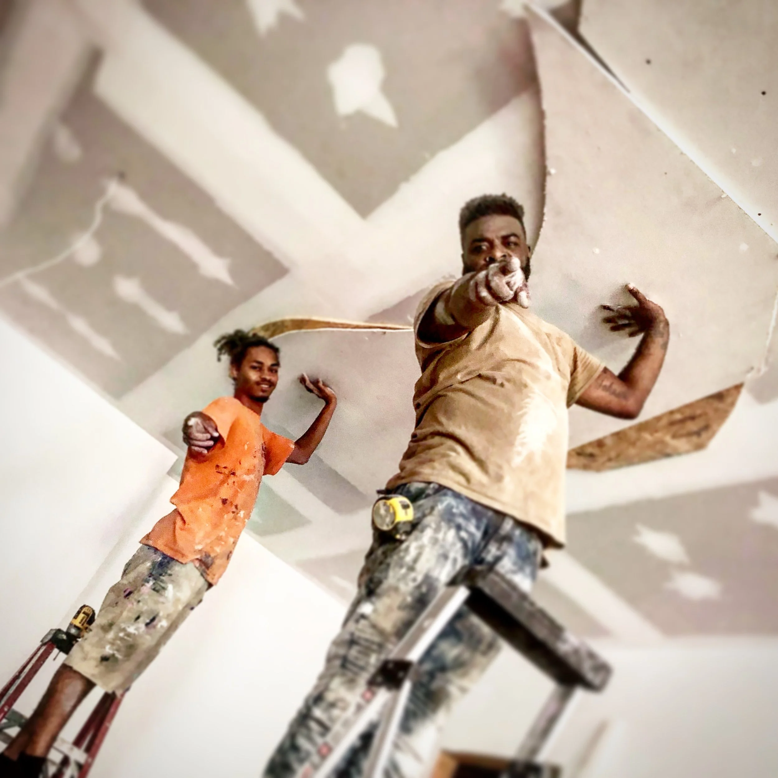 A close-up view  of ATL Basement Solutions crew hard at work building a custom modern ceiling Atlanta Ga.
