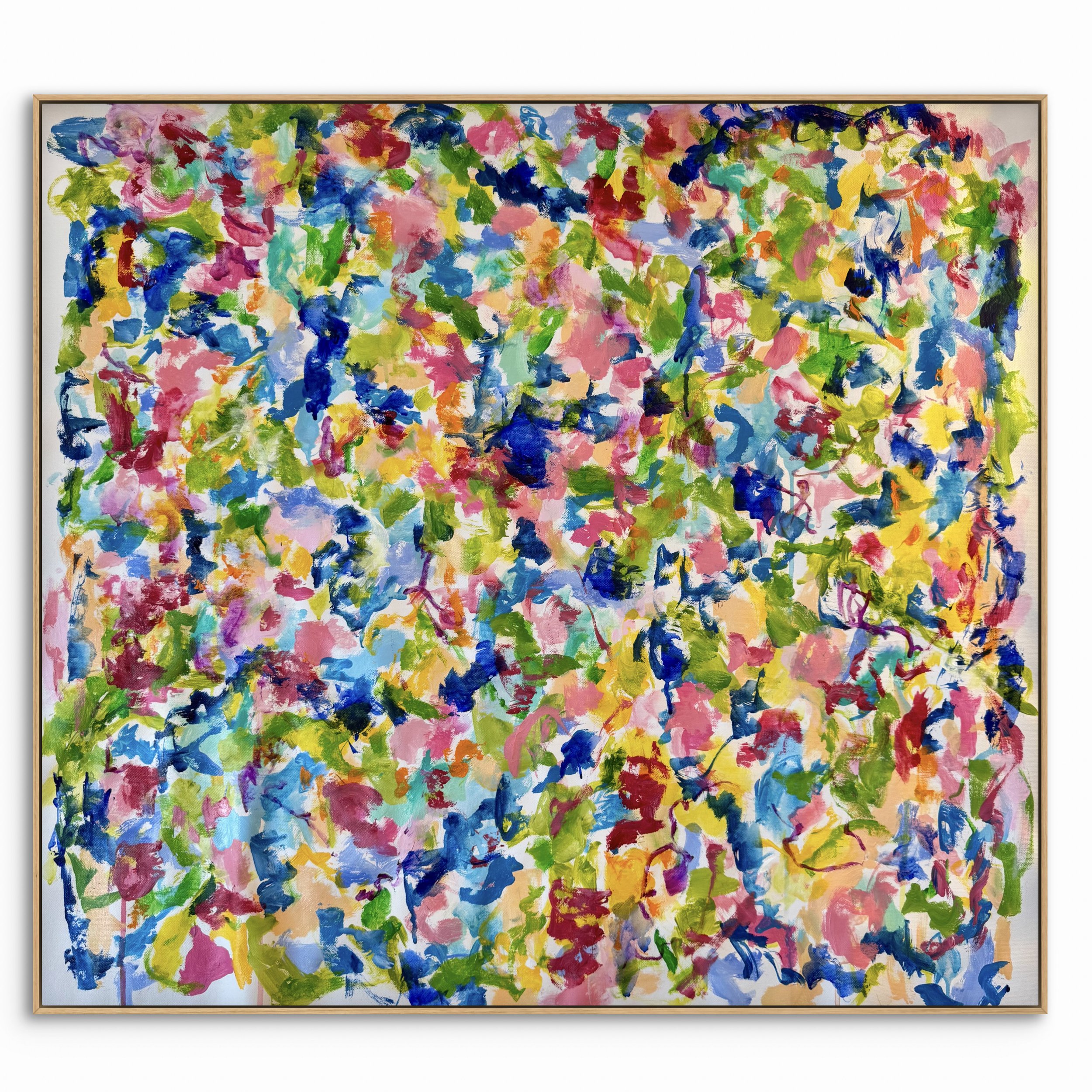 An abstract painting featuring multicolored brushstrokes in pink, blue, green, yellow, red, and purple framed in a light wooden frame.