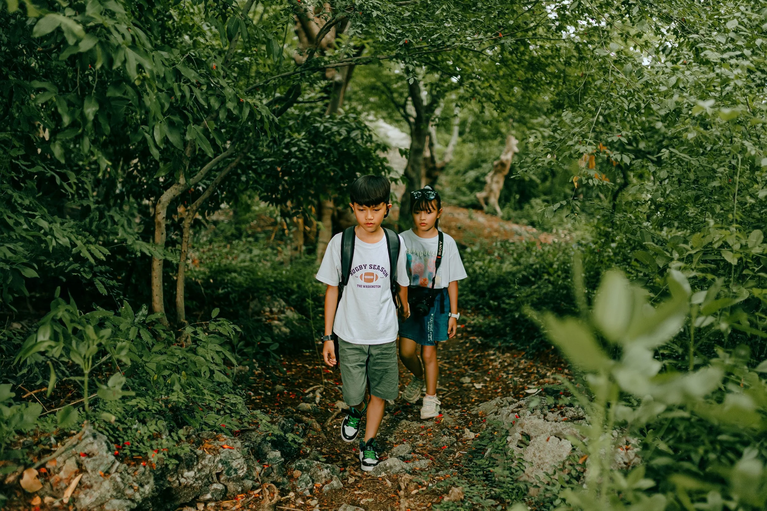 Two kids on a hiking trail