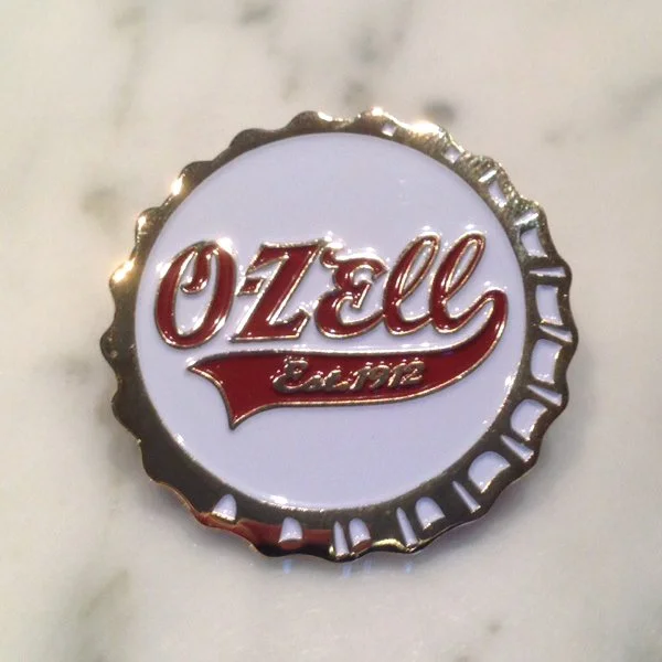 O-Zell Logo Bottle Cap Pin