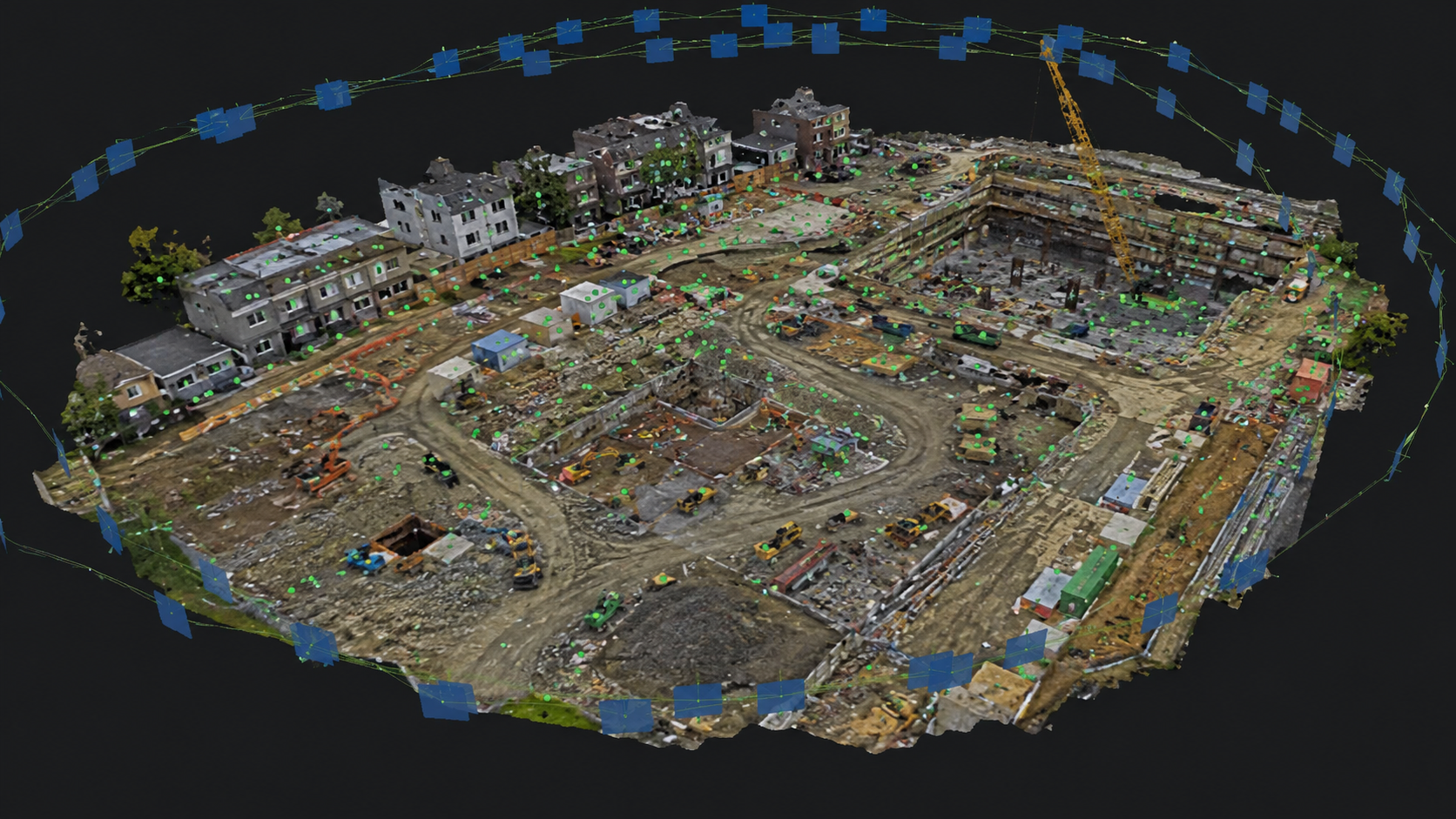 3D laser scan of a construction site with partially built structures, construction vehicles, and ongoing building work, surrounded by a digital boundary with blue markers.