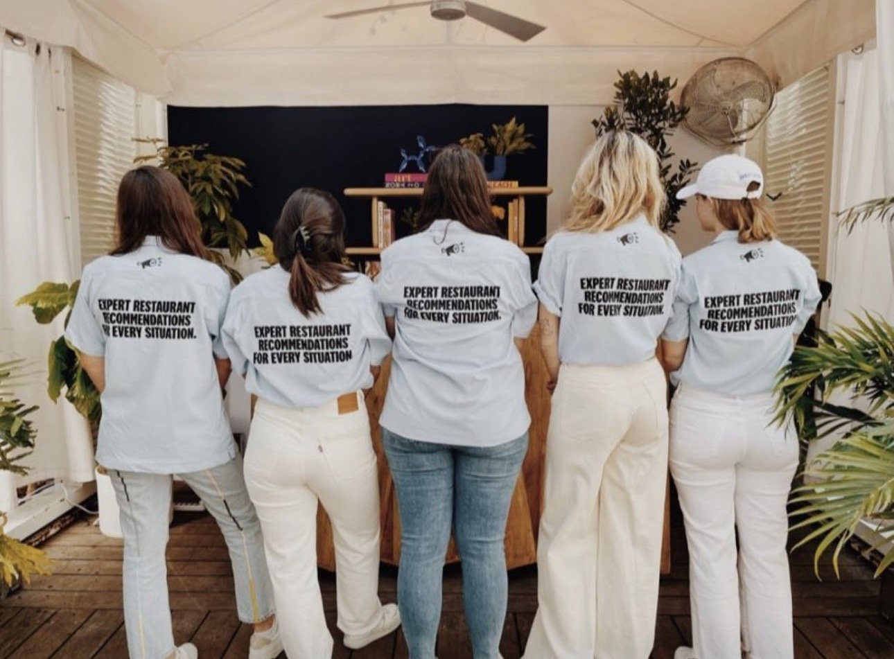 Team with branded tshirts with "expert restaurant recommendations for every situation" on it
