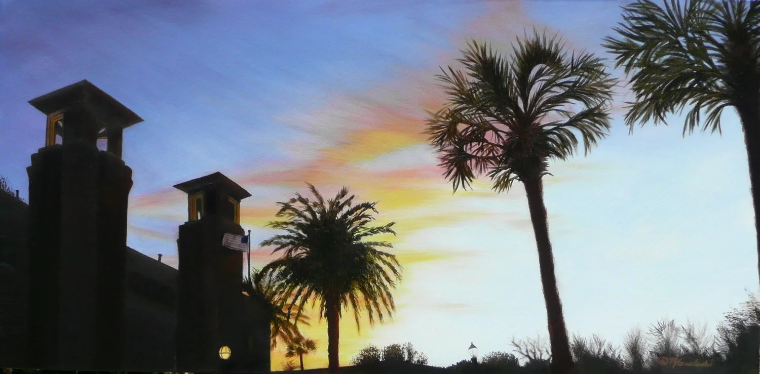 Painting of a sunset sky with colorful clouds, silhouettes of palm trees and a building with chimneys, some with American flags.