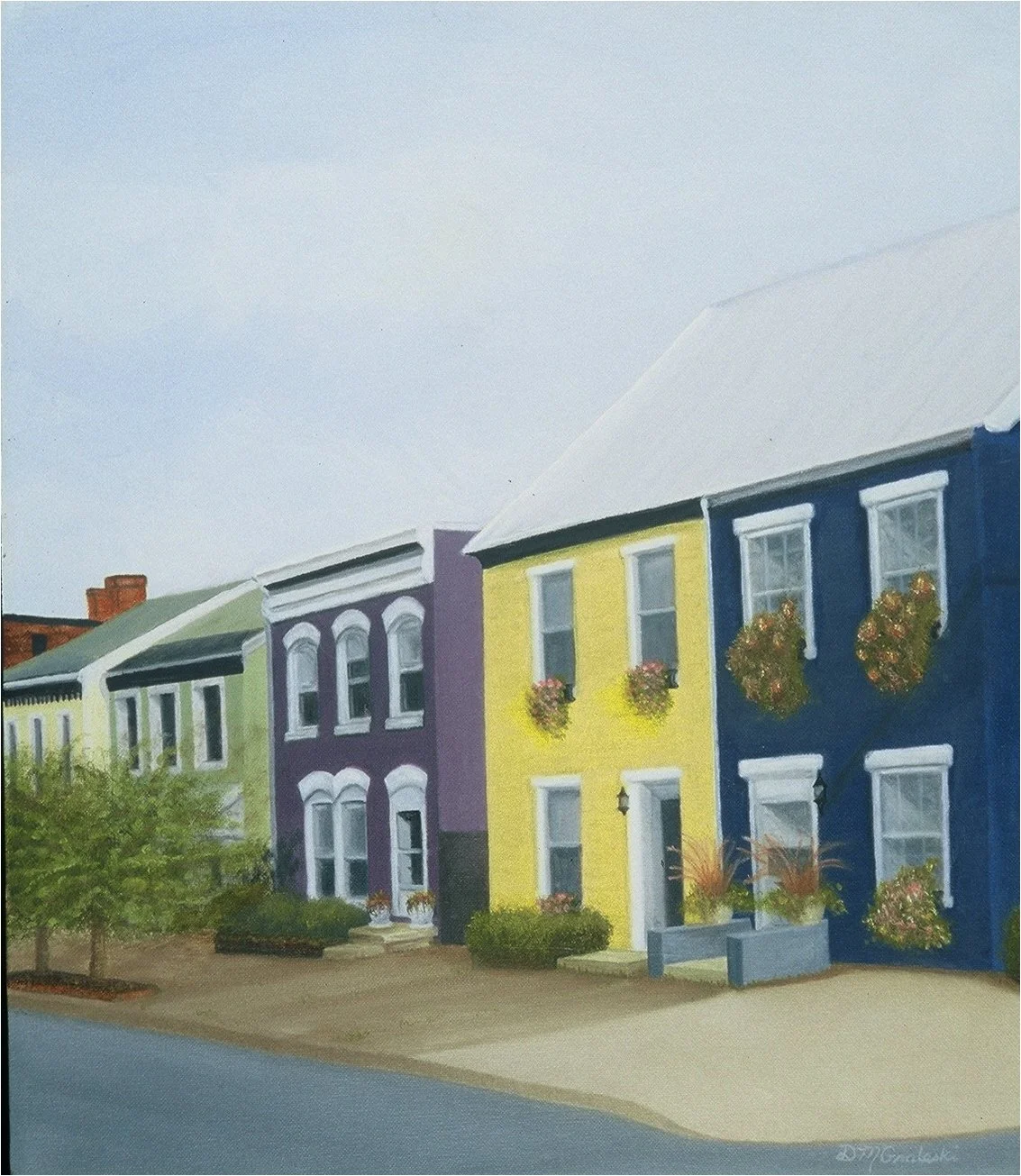 Colorful row of houses painted in yellow, blue, purple, and green with flower boxes on windows, sidewalk, and a tree in the foreground.