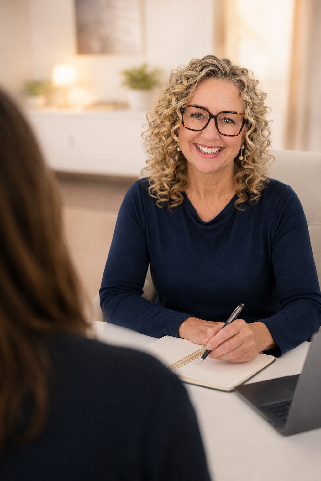 Laura Wortley of OneRecruits in conversation with a client about hiring.