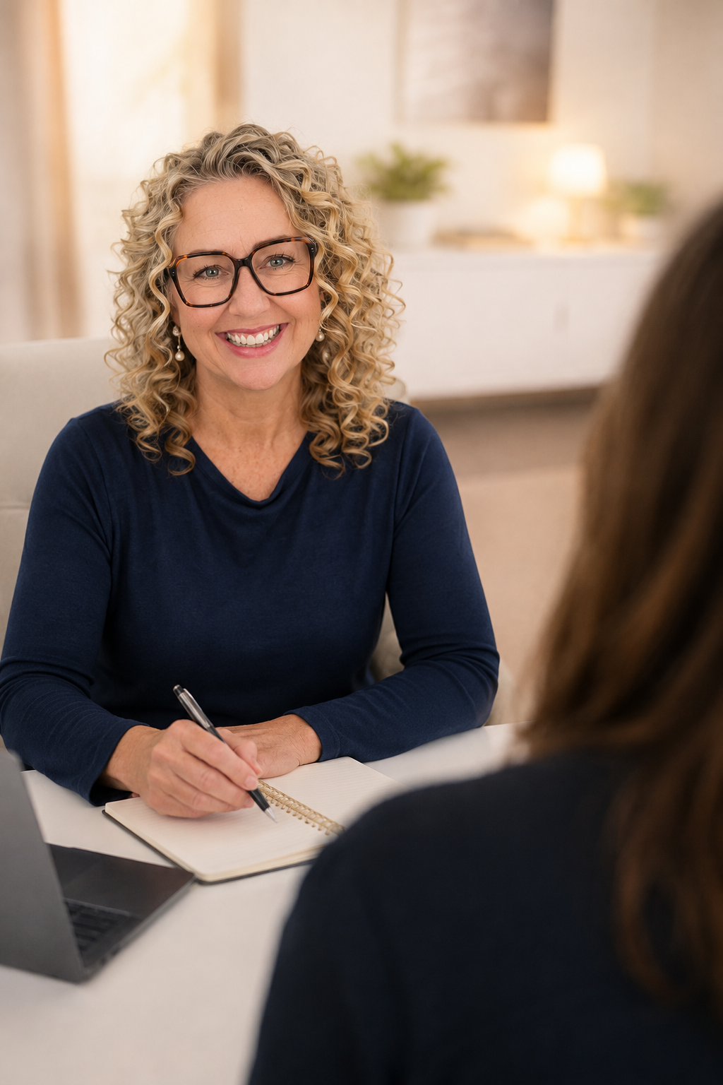 Laura Wortley of OneRecruits in conversation with a client about hiring and recruitment.