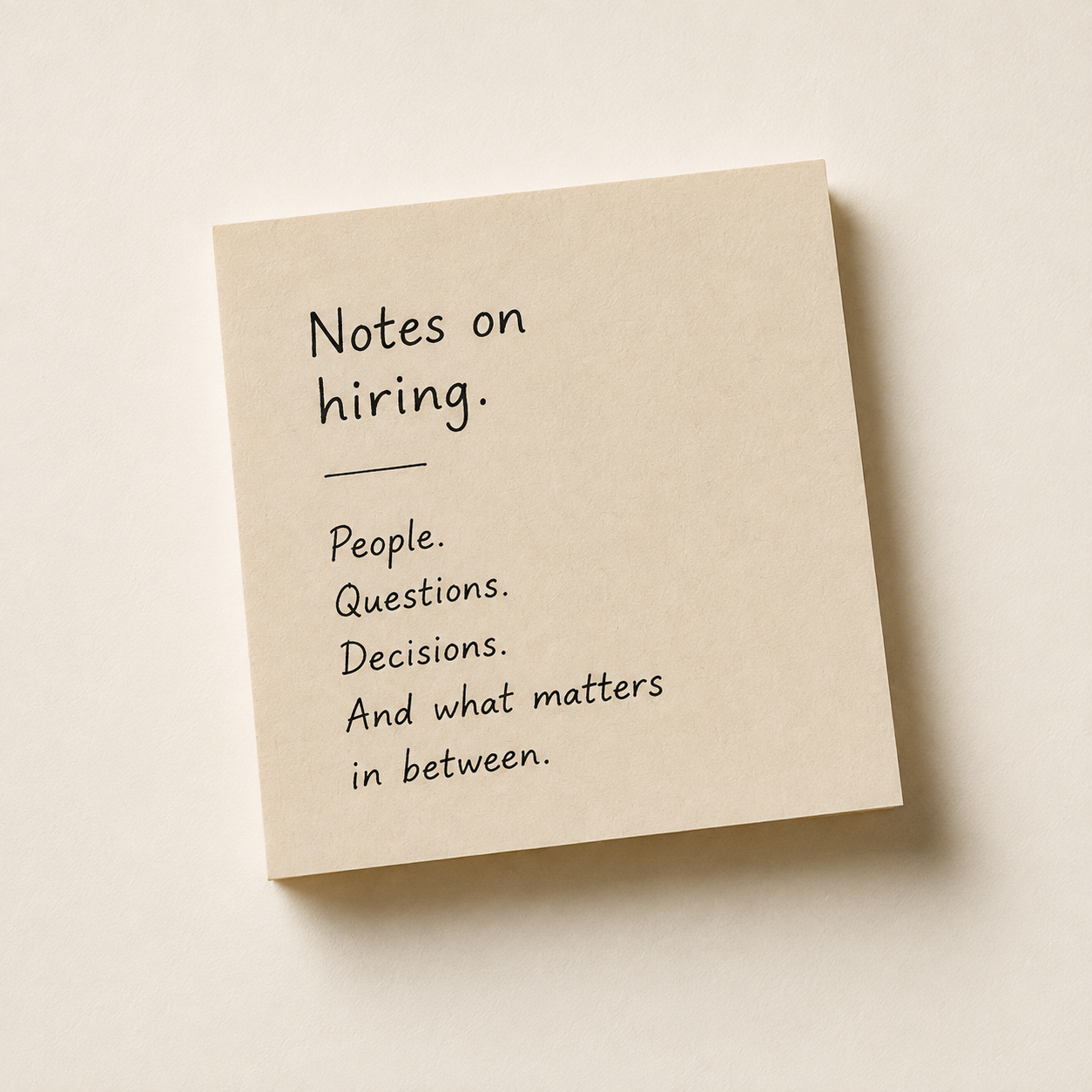 A beige sticky note with handwritten text: "Notes on hiring. People. Questions. Decisions. And what matters in between." on a light beige background.