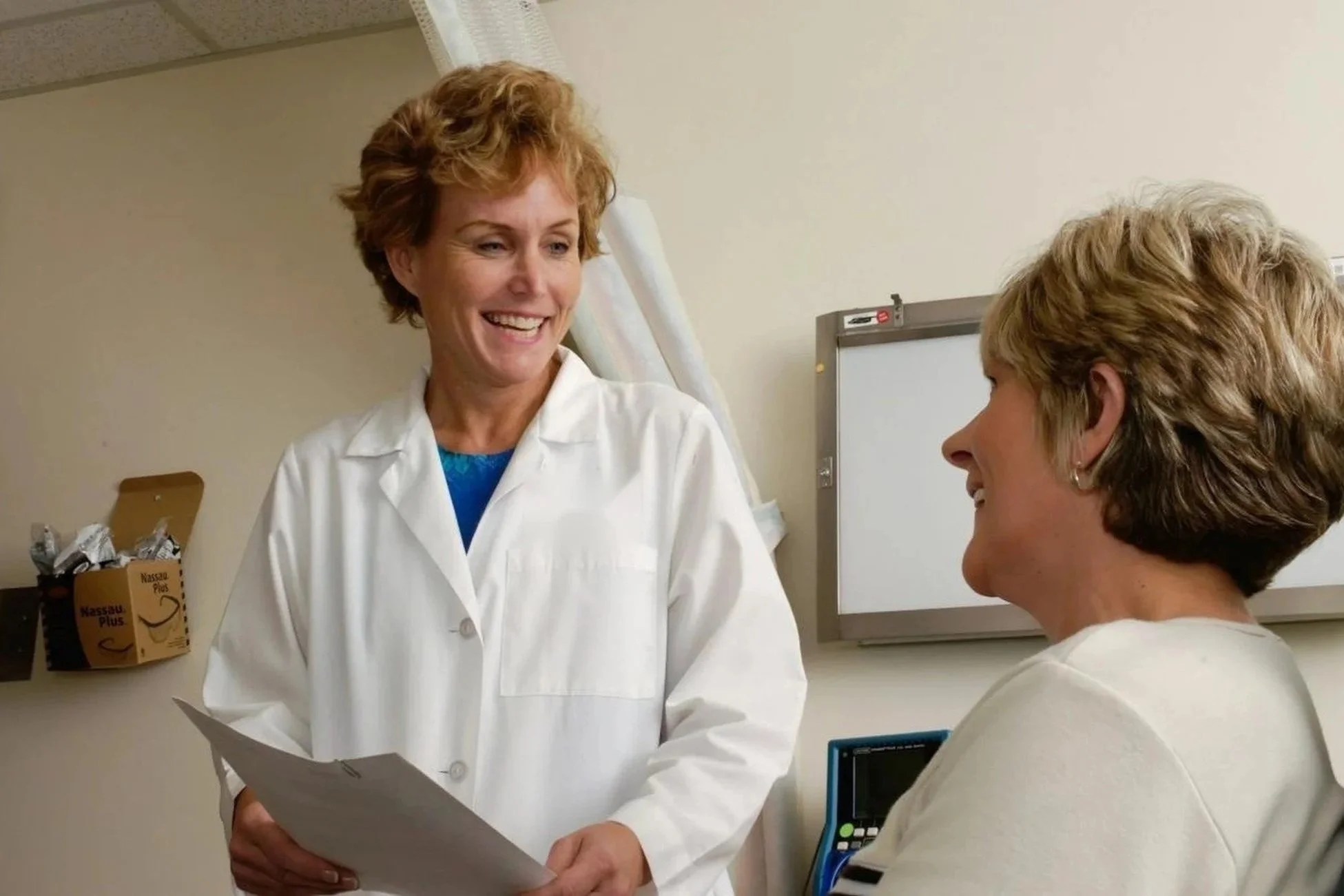 Physician consulting with a patient, representing compassionate cancer care at Dr. Priti Patel's radiation oncology practice serving Monmouth County, NJ