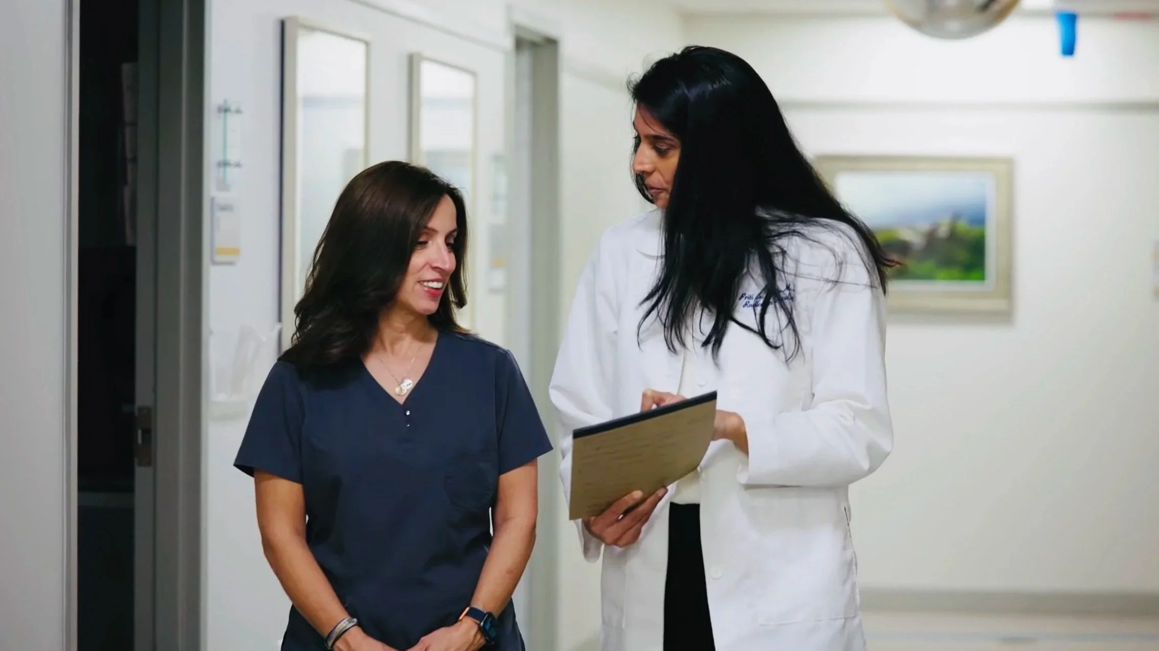 Dr. Priti Patel, board-certified radiation oncologist, consulting with a patient at Riverview Medical Center in Red Bank, NJ
