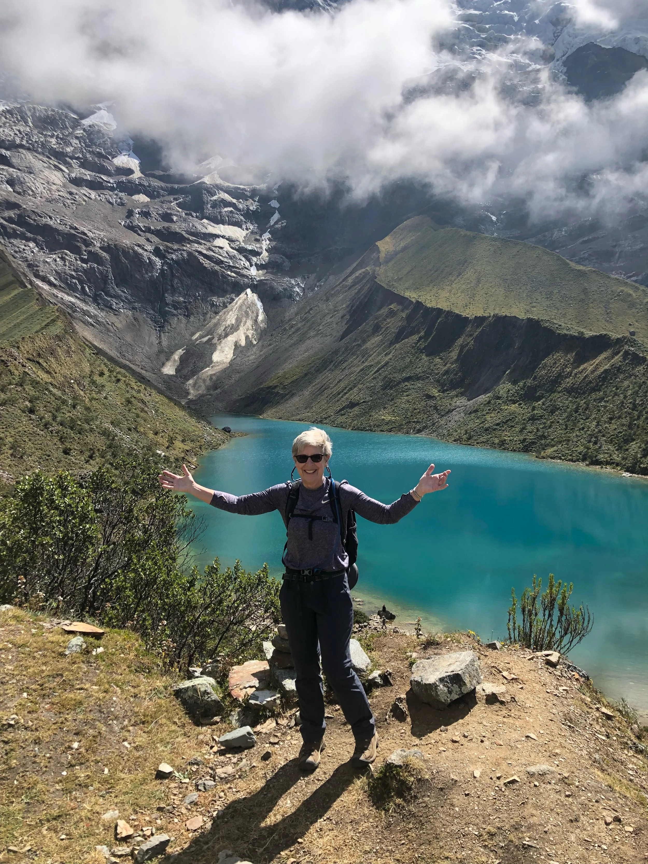 Nicole Bello client hiking in the mountains and enjoying an active lifestyle