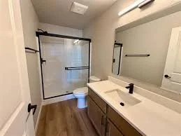 Primary bathroom at Eagle Villas in Eagle, Idaho, featuring interior trim, doors and bathroom hardware installed by West Construction Services.