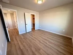 Bedroom at Eagle Villas luxury townhomes in Eagle, Idaho, featuring interior trim and door installation by West Construction Services.