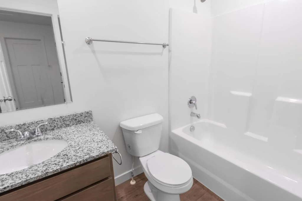 Bathroom at Laguna Farms – Delinda Townhomes in Nampa, Idaho, featuring door, trim and interior finish installation by West Construction Services.