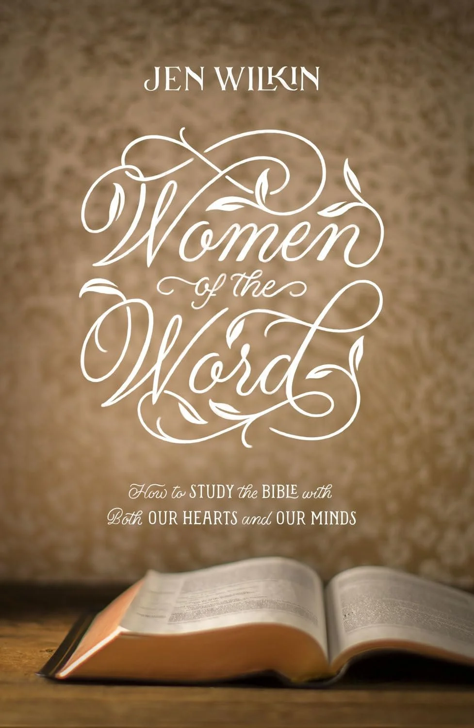 Book titled 'Women of the Word' by Jen Wilkin, with an open Bible at the bottom of the image, set against a brown background.