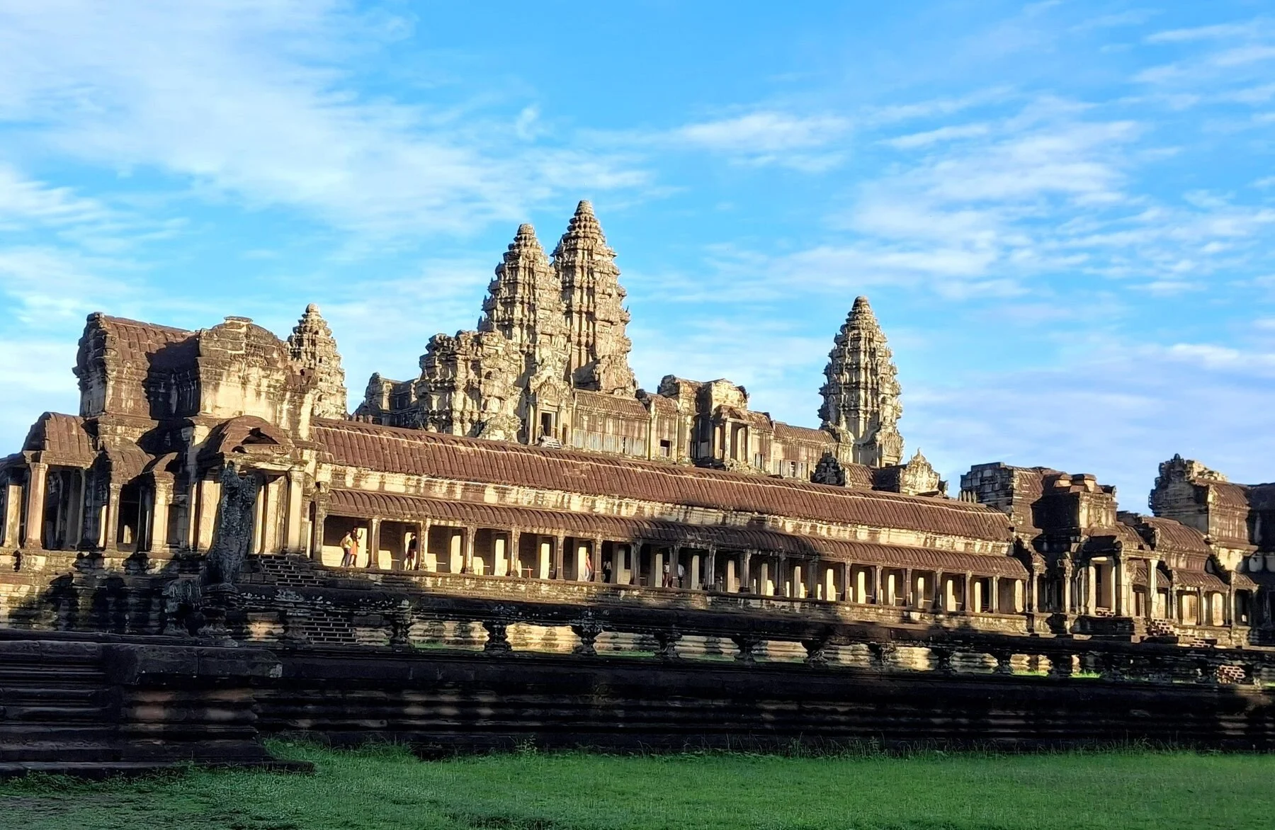 Angkor Wat temple complex in Siem Reap, Cambodia under a bright blue sky