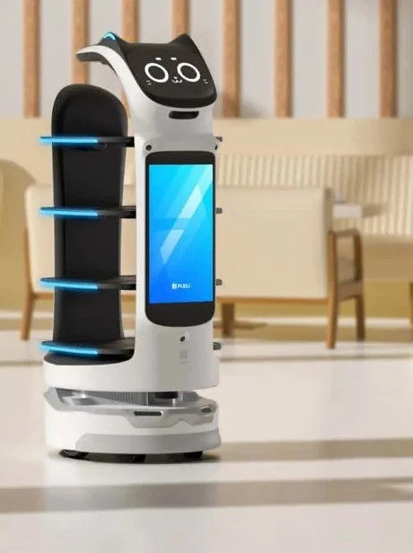 Caddybot B2 (Bella) service robot from Caddy Robotics, a rebranded Pudu BellaBot, with stacked serving trays.