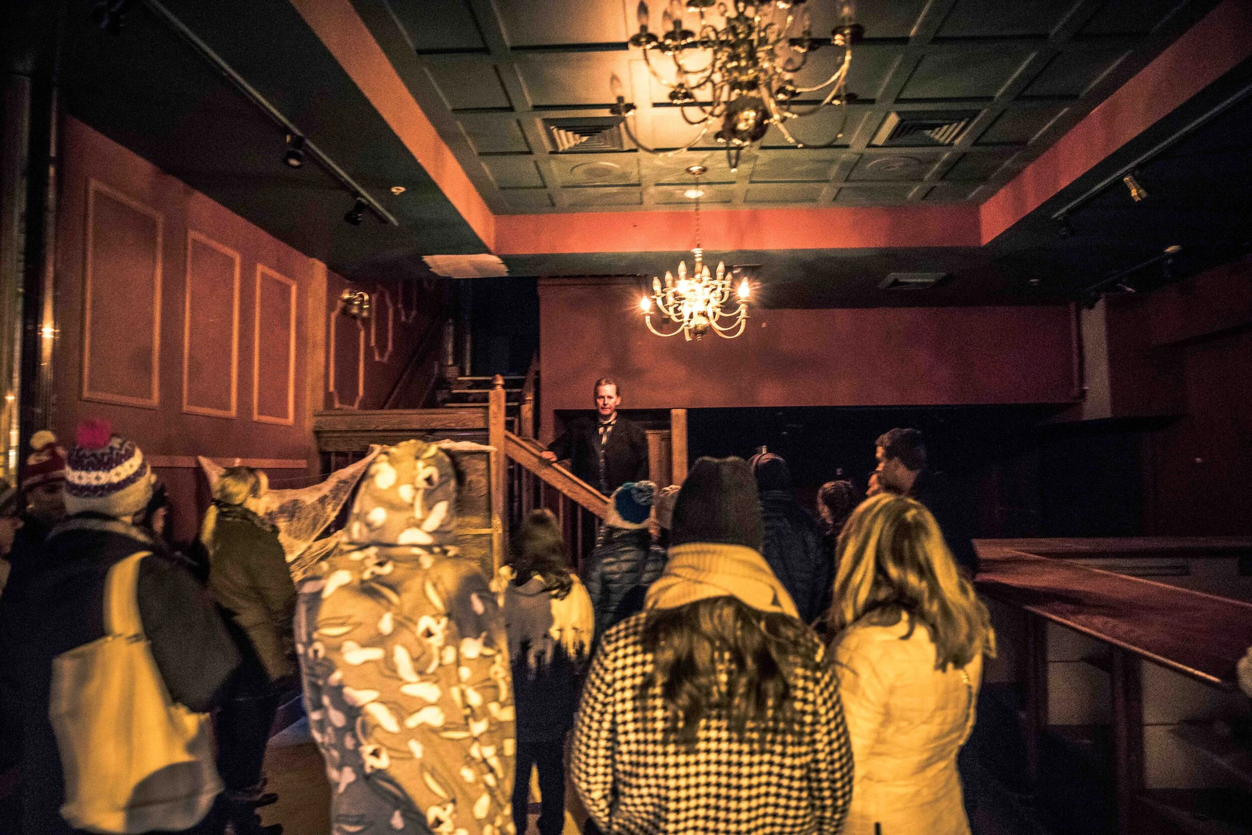 Attendees shiver in their boots during a spooky presentation during the annual Creepy Crawl.