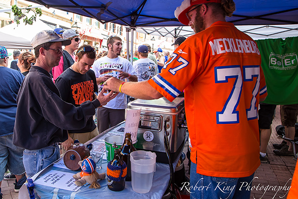 volunteers handing out beer to patrons at the beer festival
