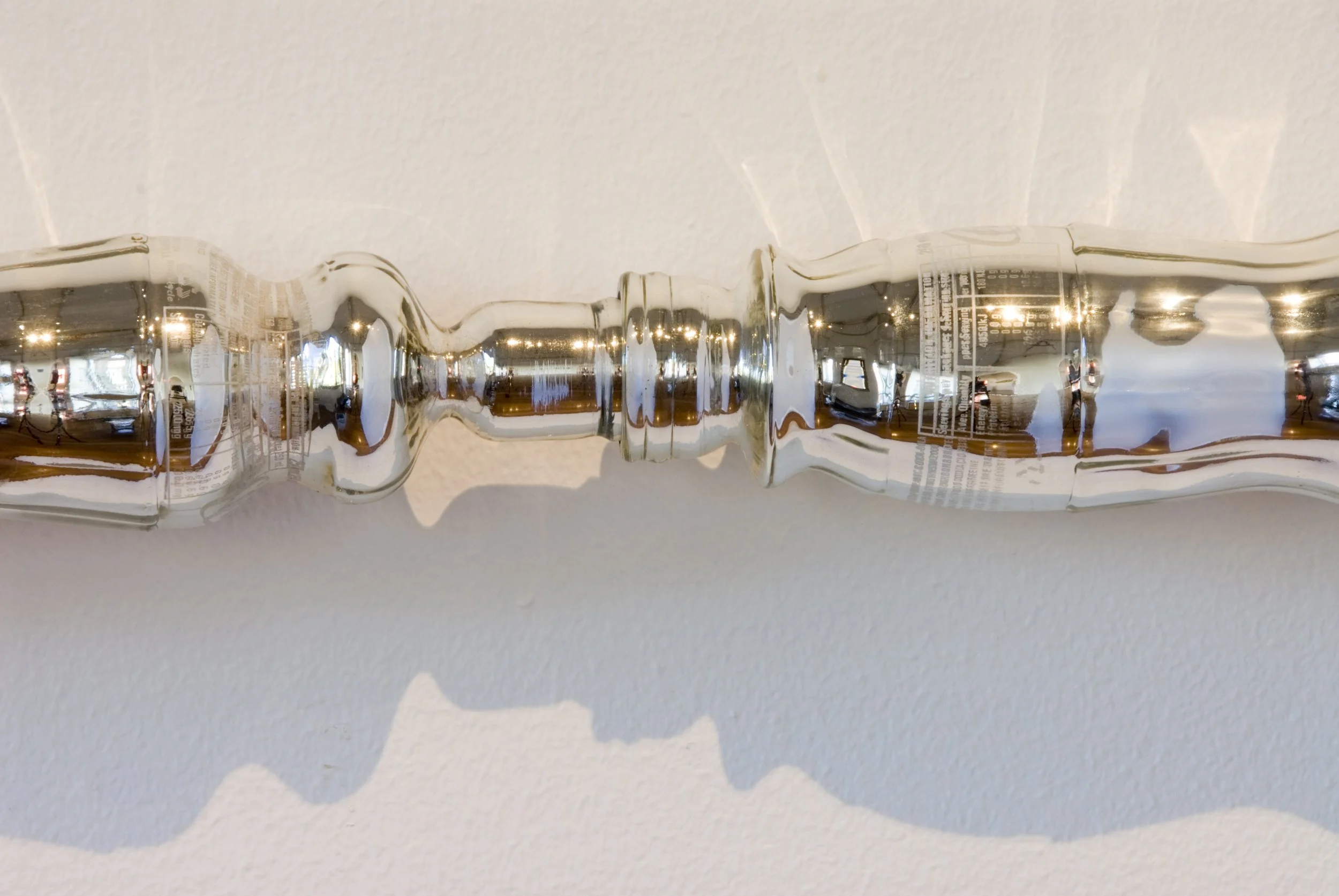 Protracted Perception, 2007, hot formed glass, silver, perspex, 3000x75x75mm.
Photographer: Greg Piper  