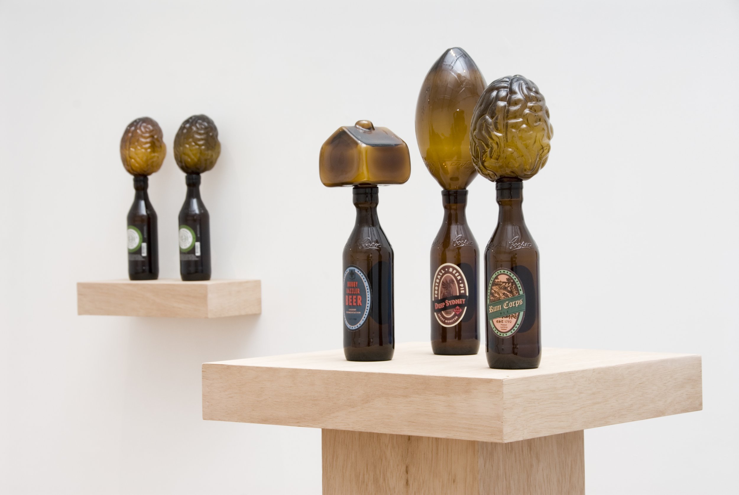 Gathering of the Kingbrowns, 2009, hot formed and moulded recycled glass, adhesive labels, 450x450x550mm. Photographer: Greg Piper  