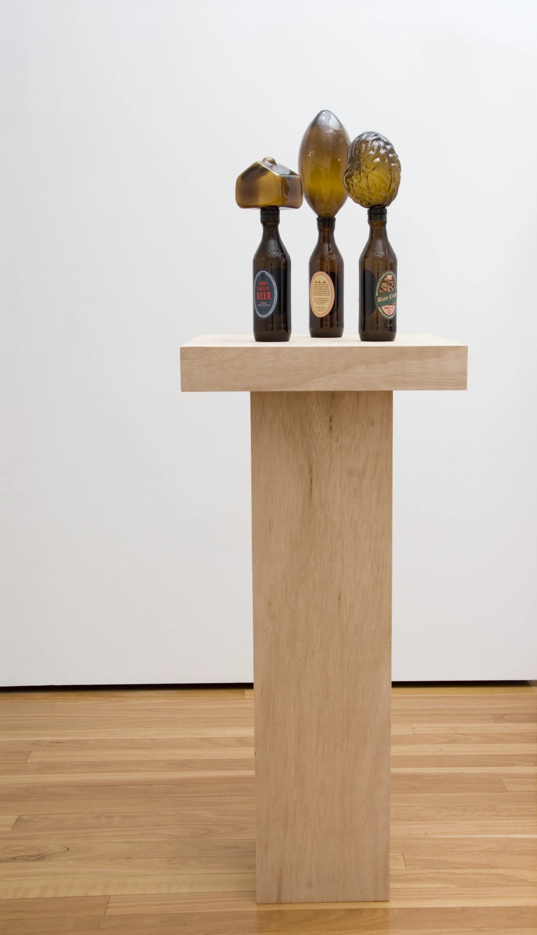 Gathering of the Kingbrowns, 2009, hot formed and moulded recycled glass, adhesive labels, 450x450x550mm. Photographer: Greg Piper  
