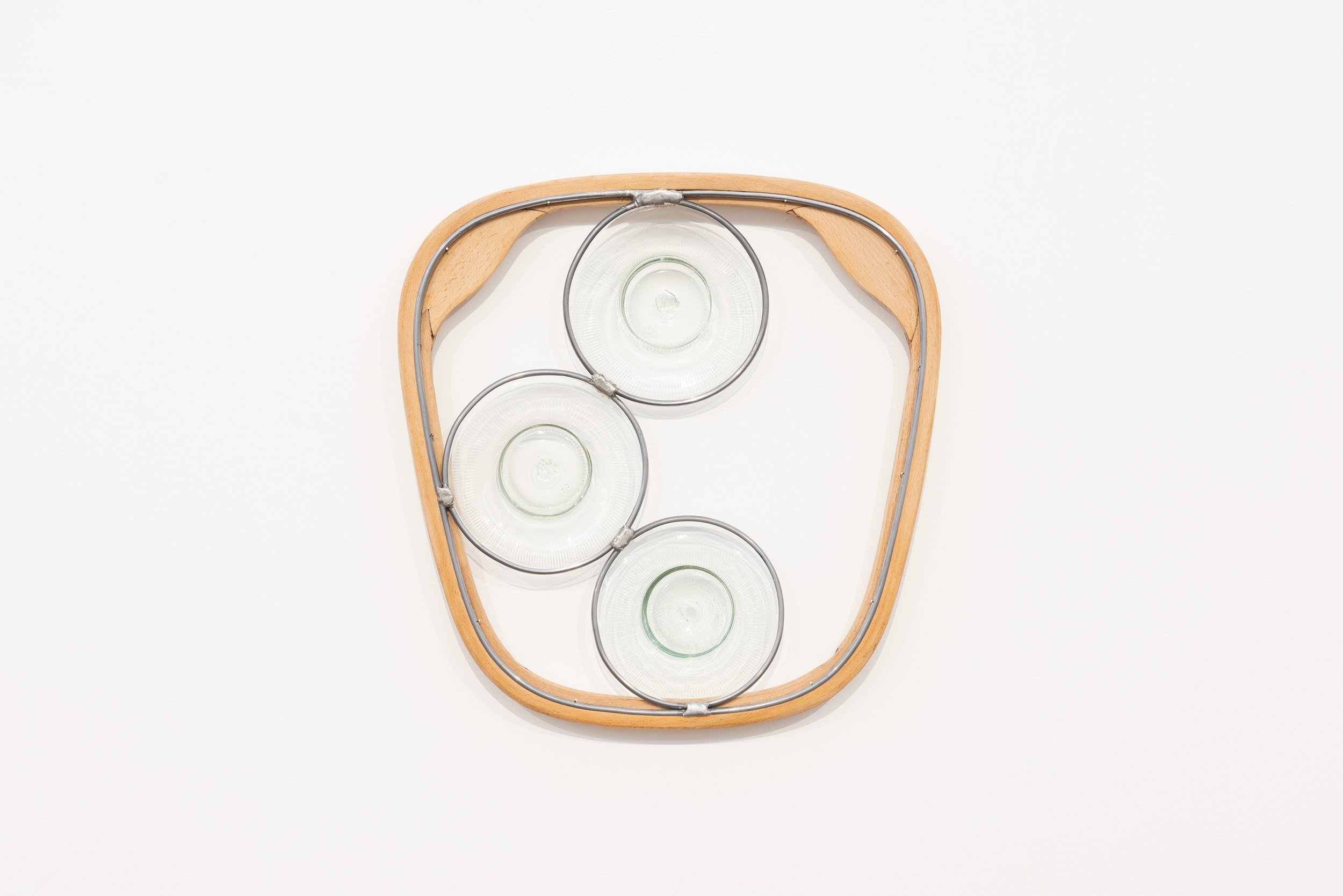 Abstract Afternoon Reflection (Partial Decant), 2026. 400x395x35mm. Found bentwood chair part, blown and lead-lighted found glass bottles.
Photographer: Gary Trinh

