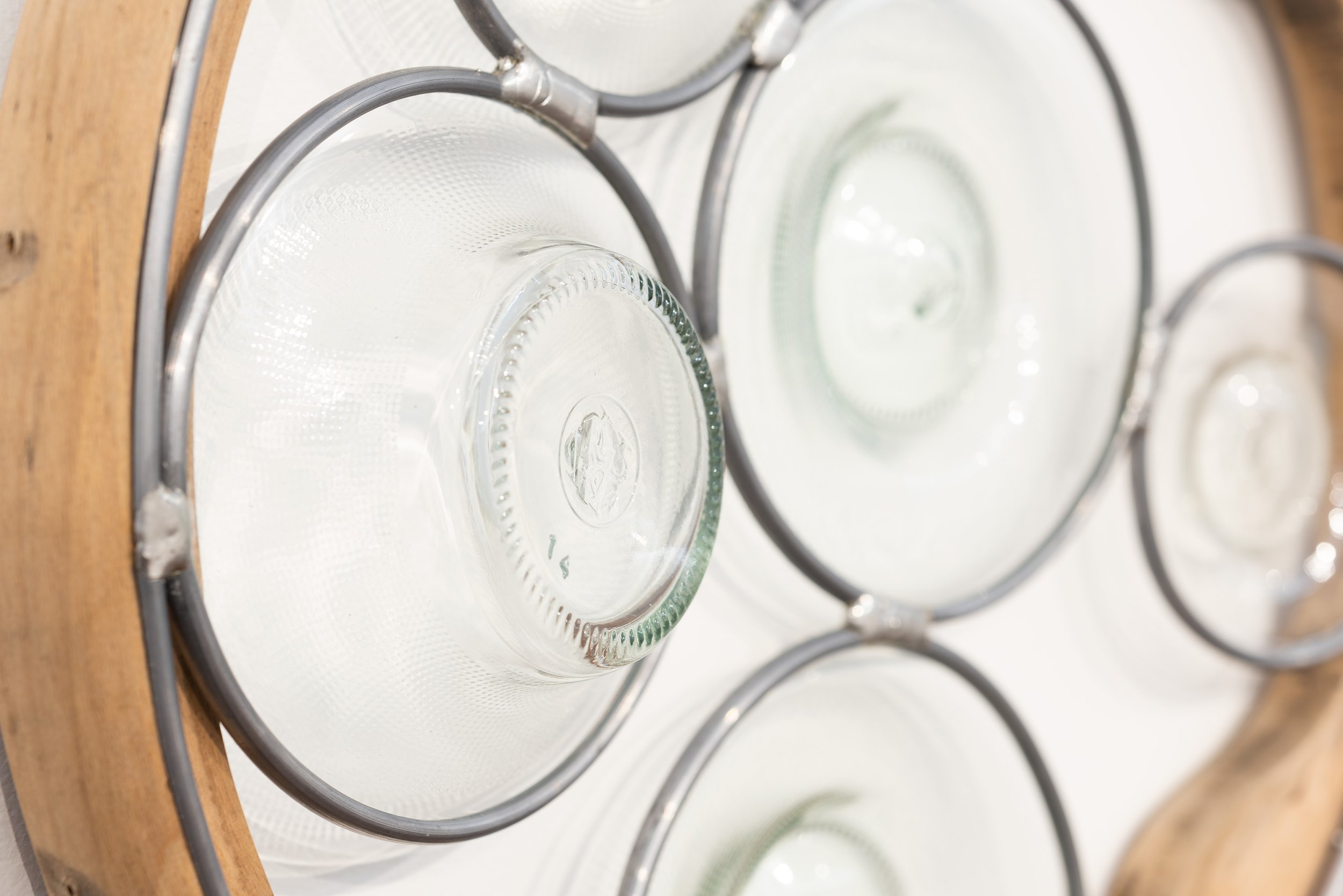 Abstract Afternoon Reflection (Strange Love, Circular), 2026. 410x70mm. Found and glued bentwood chair parts, blown and lead-lighted found glass bottles. Photographer: Gary Trinh
