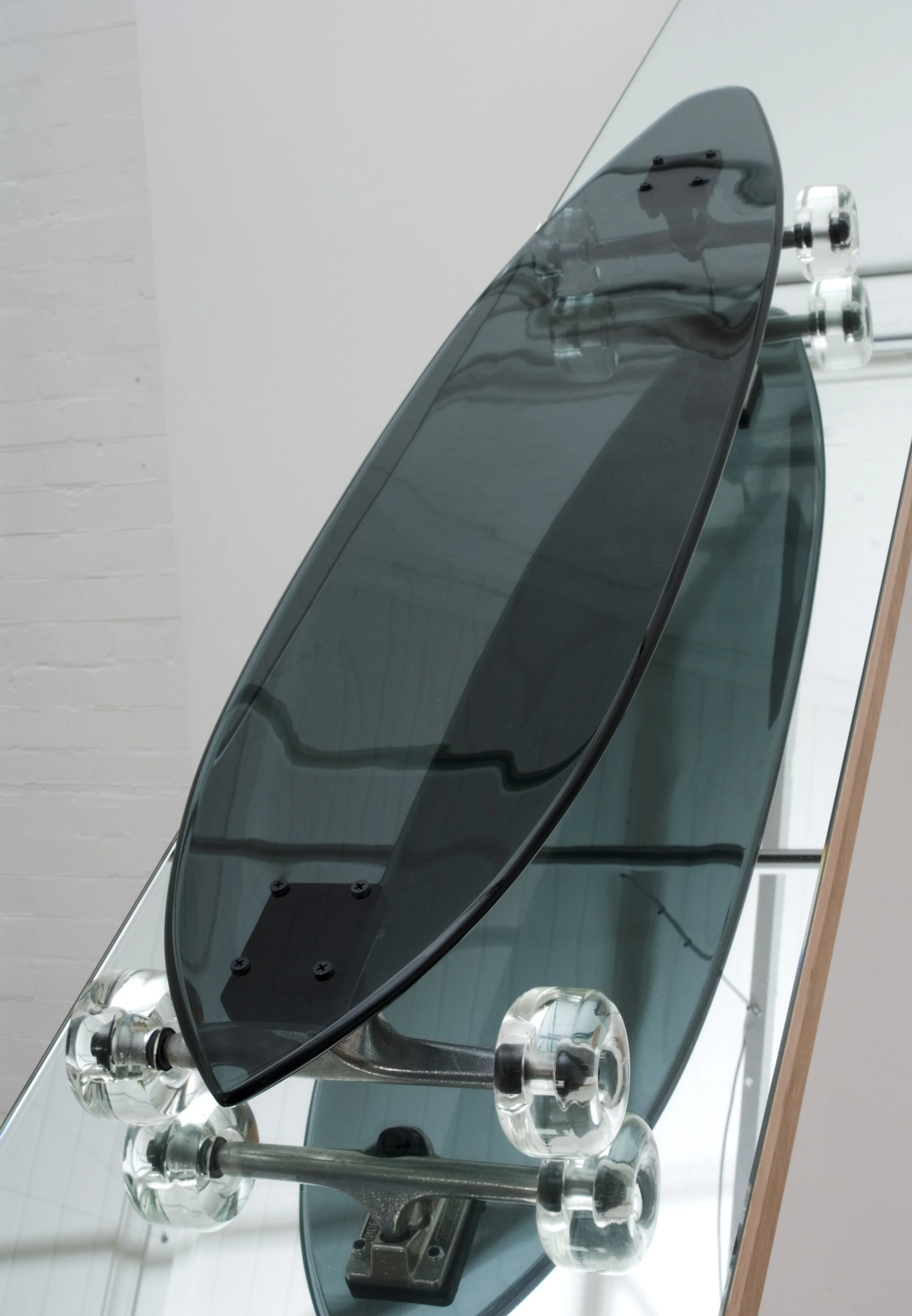 Downhill Accessory, 2009, plywood, sandstone, kiln and hot formed glass, mirror, skateboard trucks and bearings, 4500x420x240mm. Photographer: Greg Piper