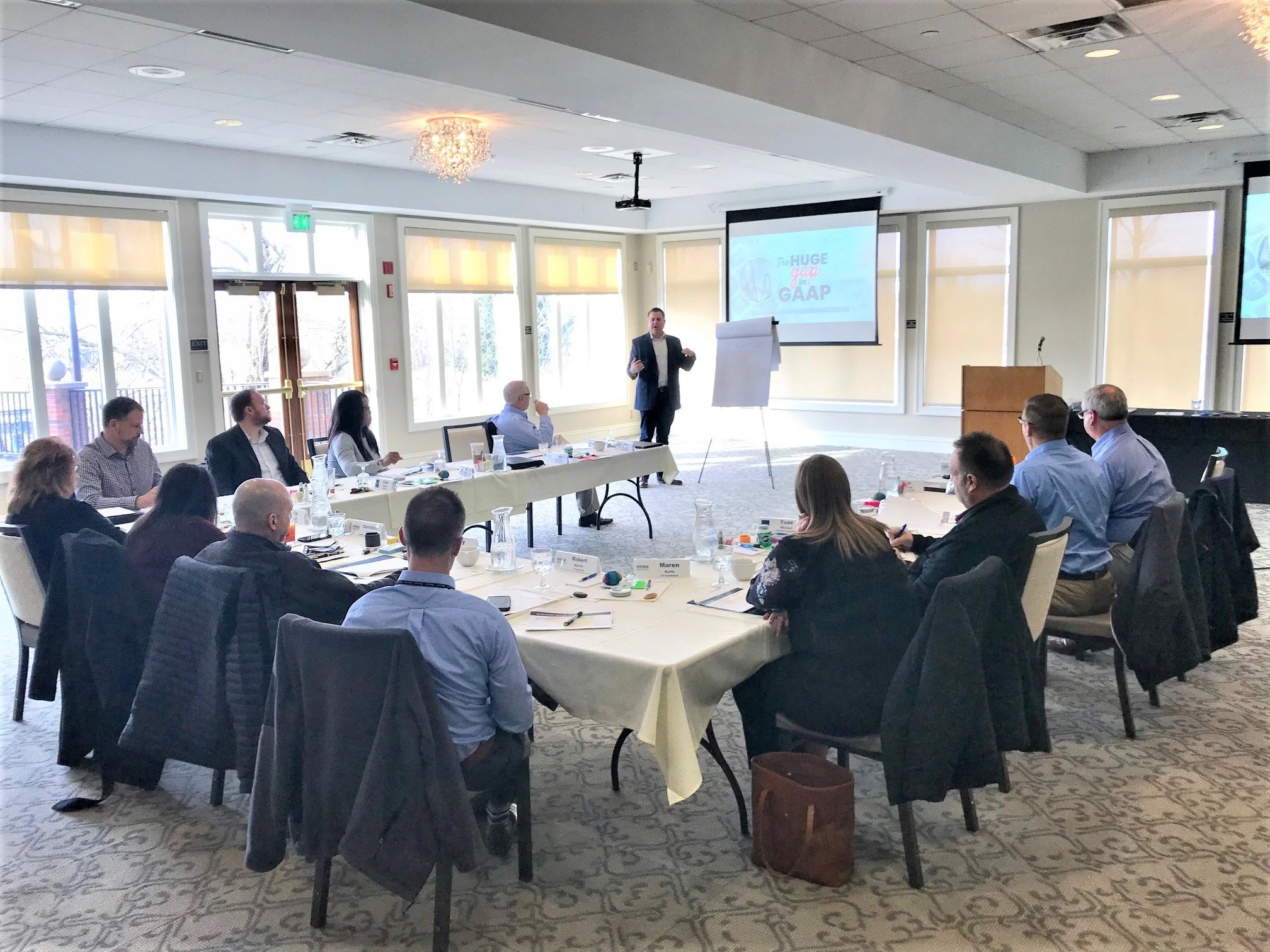 Owner-level executives in a Vistage session on applying AI inside operating companies.