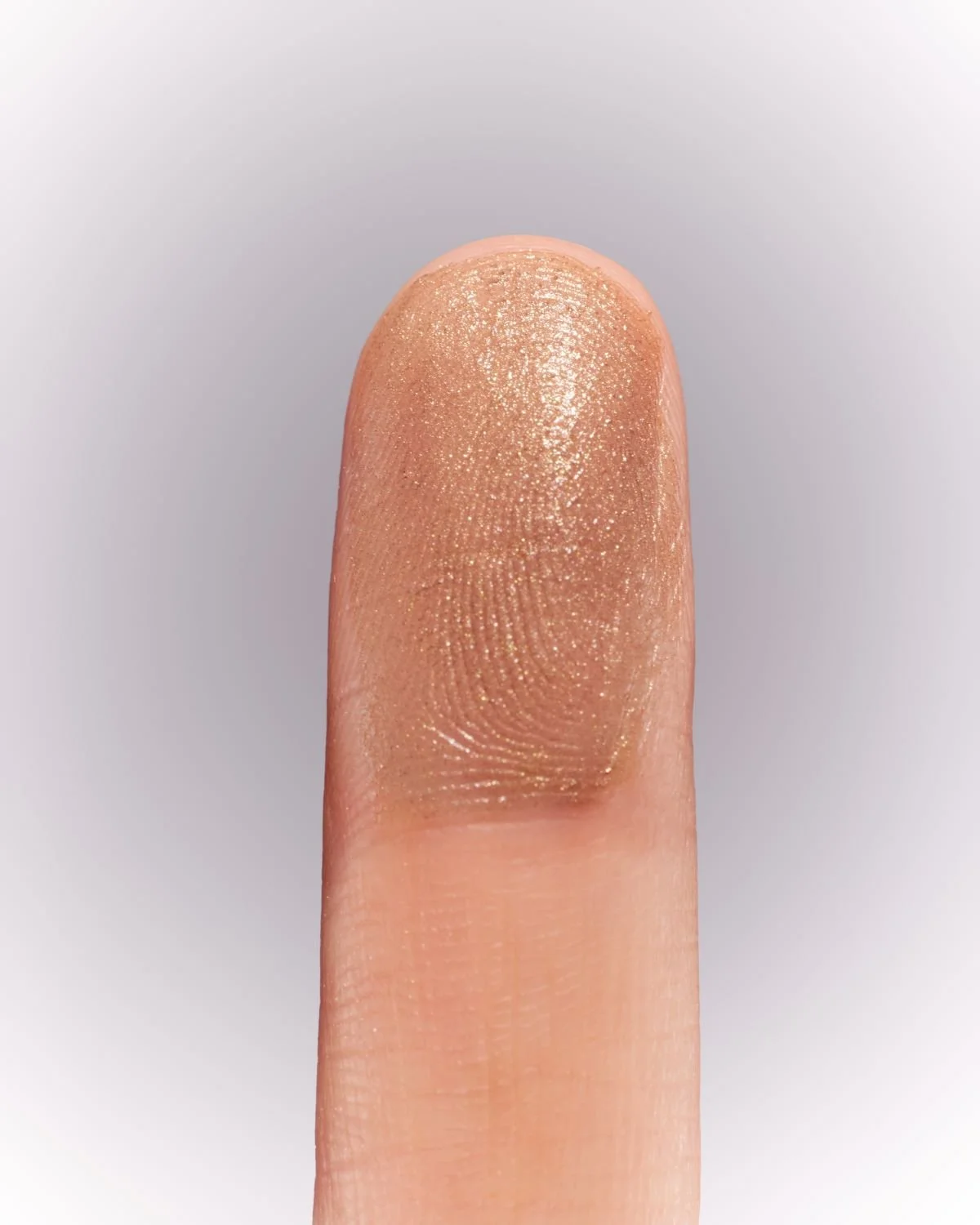 2_RATIONALE-BEAUTIFUL-BALMS-BRONZE_Finger-1.jpg