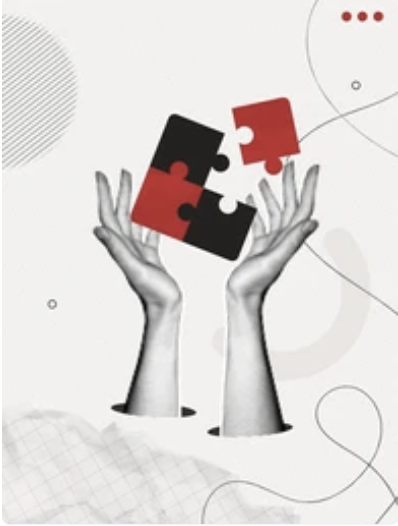 Two hands holding interlocking black and red puzzle pieces.