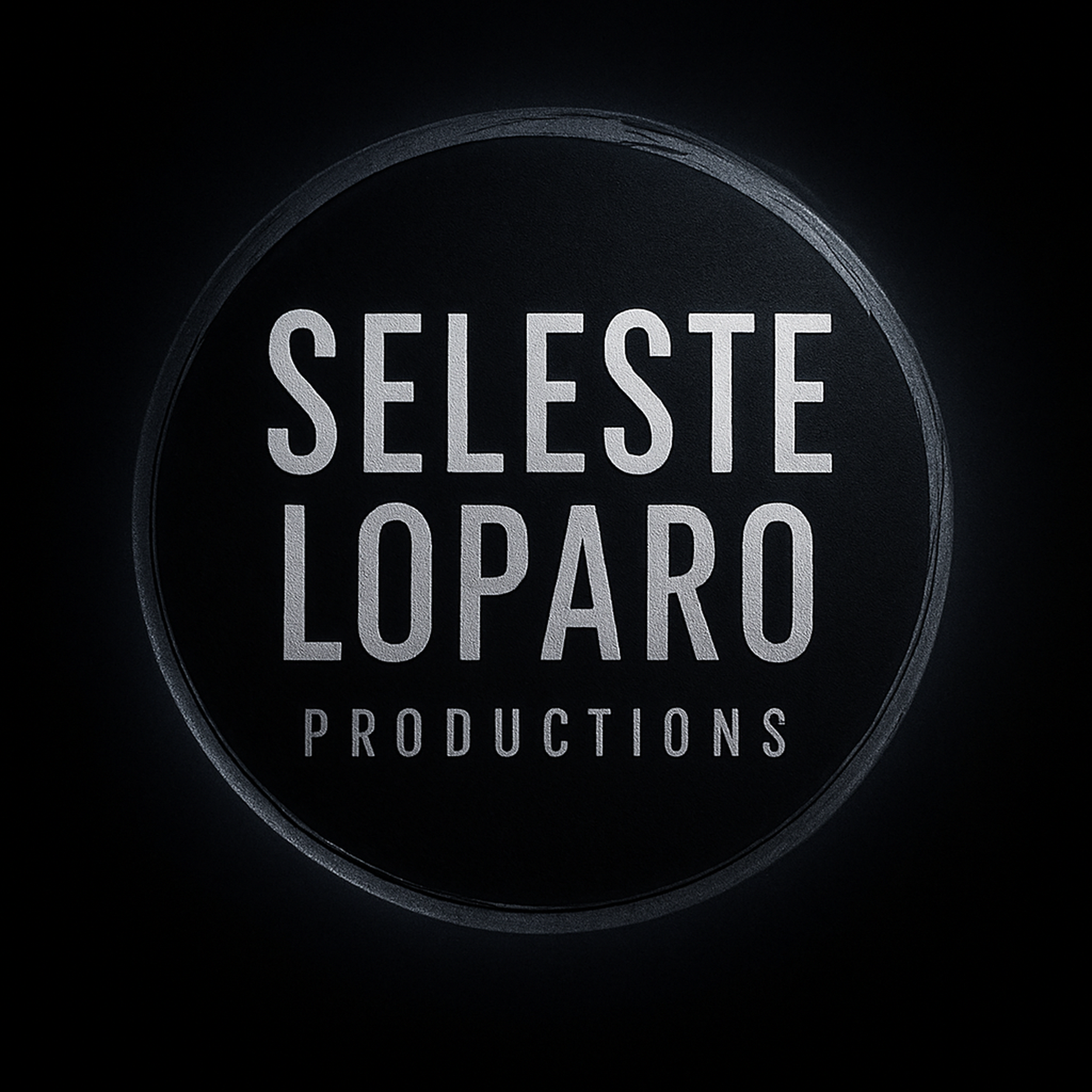 Close-up of a black round button with silver text reading 'SELECT-LOAD-LOAD' on a dark background.