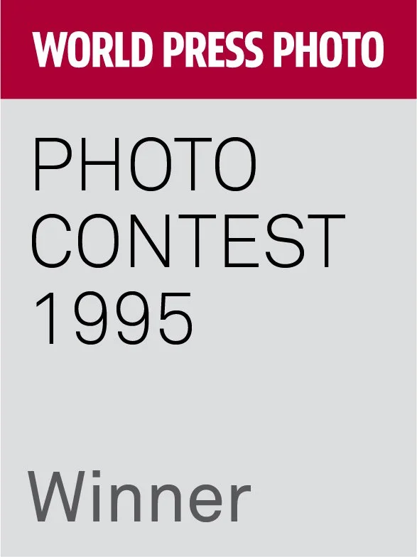 Certificate with red top banner reading 'World Press Photo', black text 'Photo Contest 1995', and gray text 'Winner'.