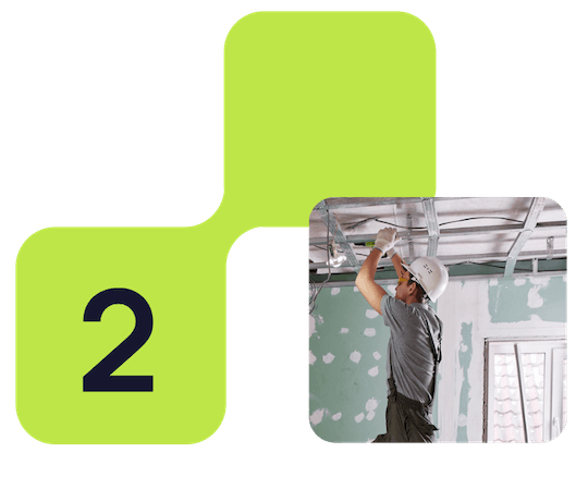 A graphic of a lime green puzzle piece with the number 2 on it, connected to a photo of a construction worker installing or working on a ceiling in a room under renovation. Step 2 - create a job.