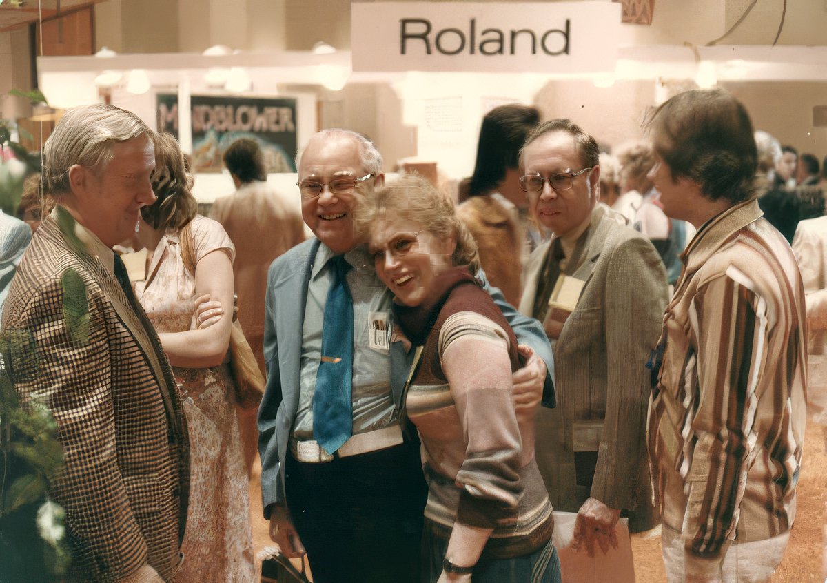 Leo Fender, George Fullerton, and Forrest White with Carol Kaye (circa 1974 at a trade show)