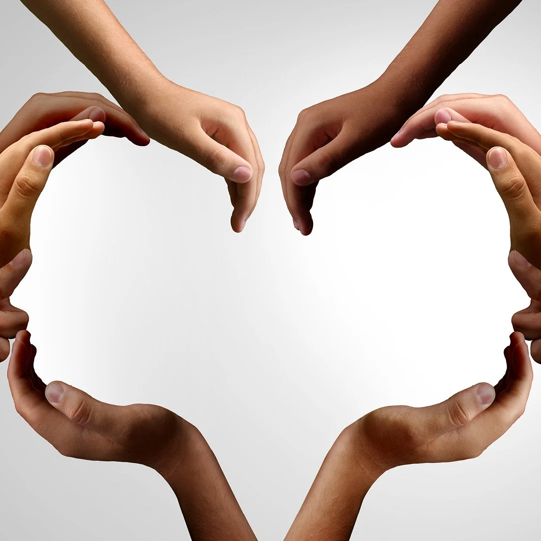 Diverse hands forming a protective circular frame around an empty white center