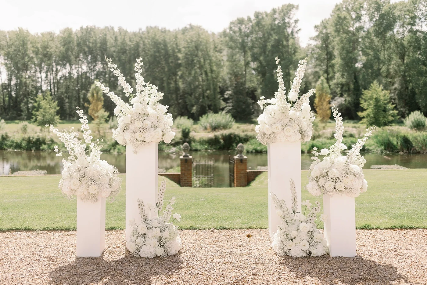 Floral pedestal decorations for a wedding ceremony at Oxnead Hall in North Norfolk, planned by Emily Andrew