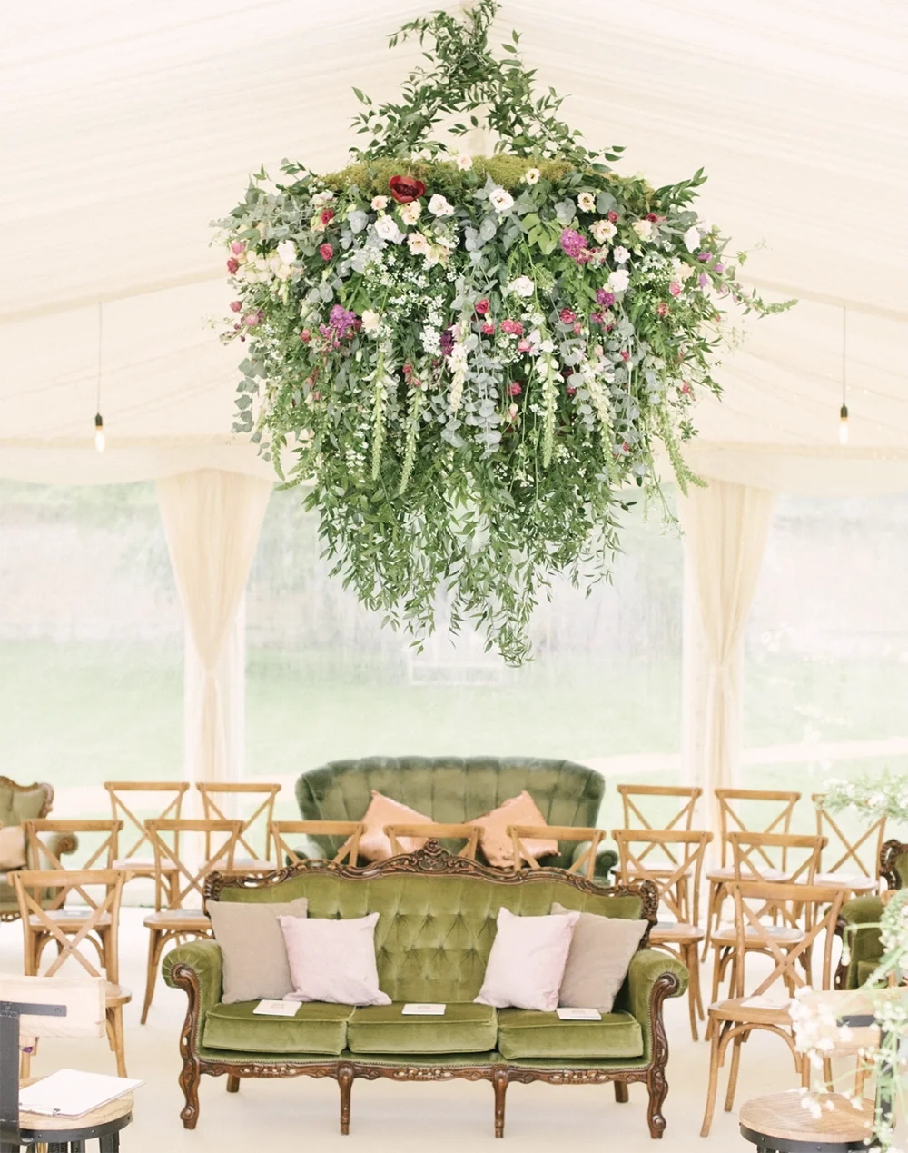A floral ball decoration in a wedding marquee
