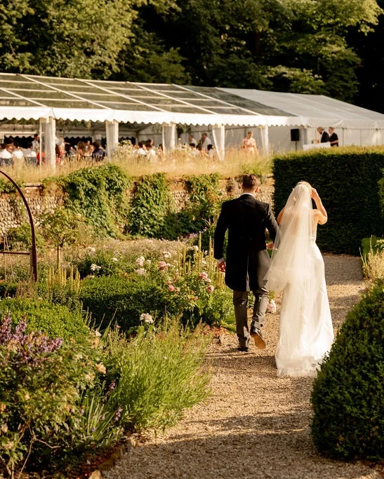 A newlywed couple in the sunken garden at Voewood in North Norfolk
