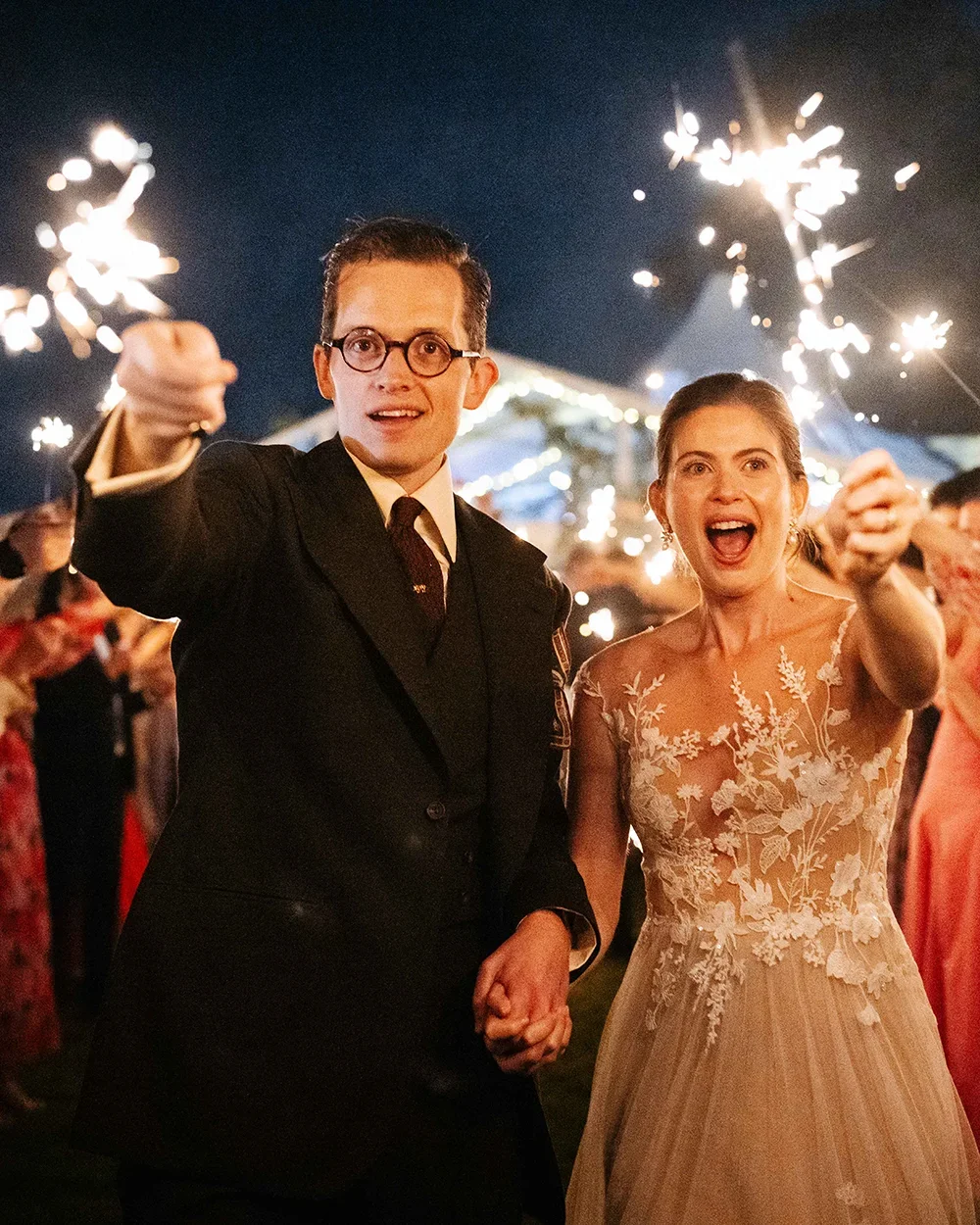 A wedding couple with sparklers at their private home wedding in Norfolk