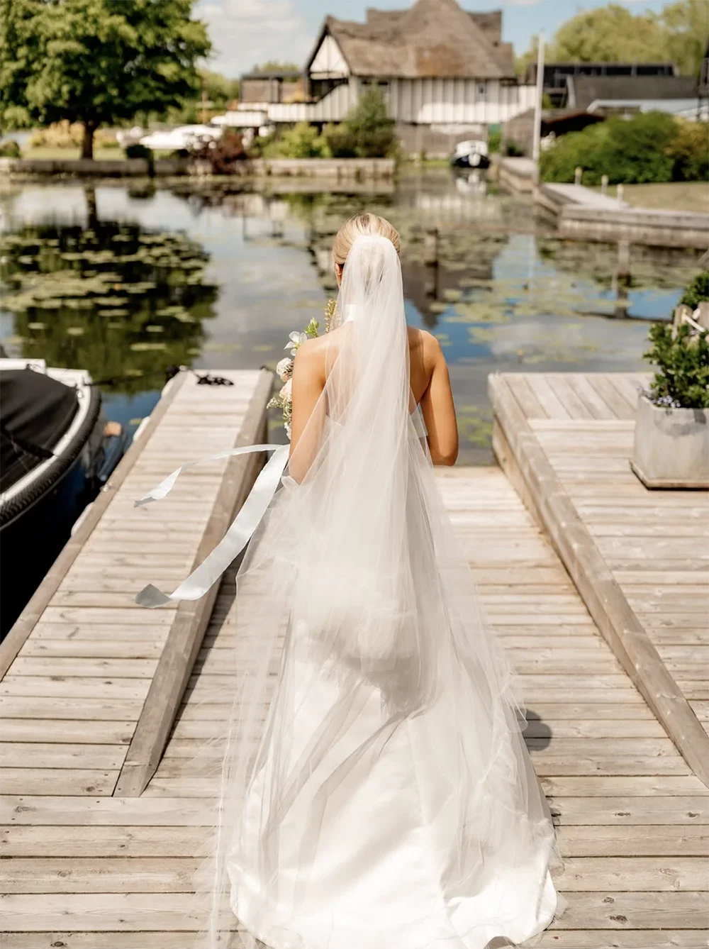 A bride on a waterfront in East Anglia