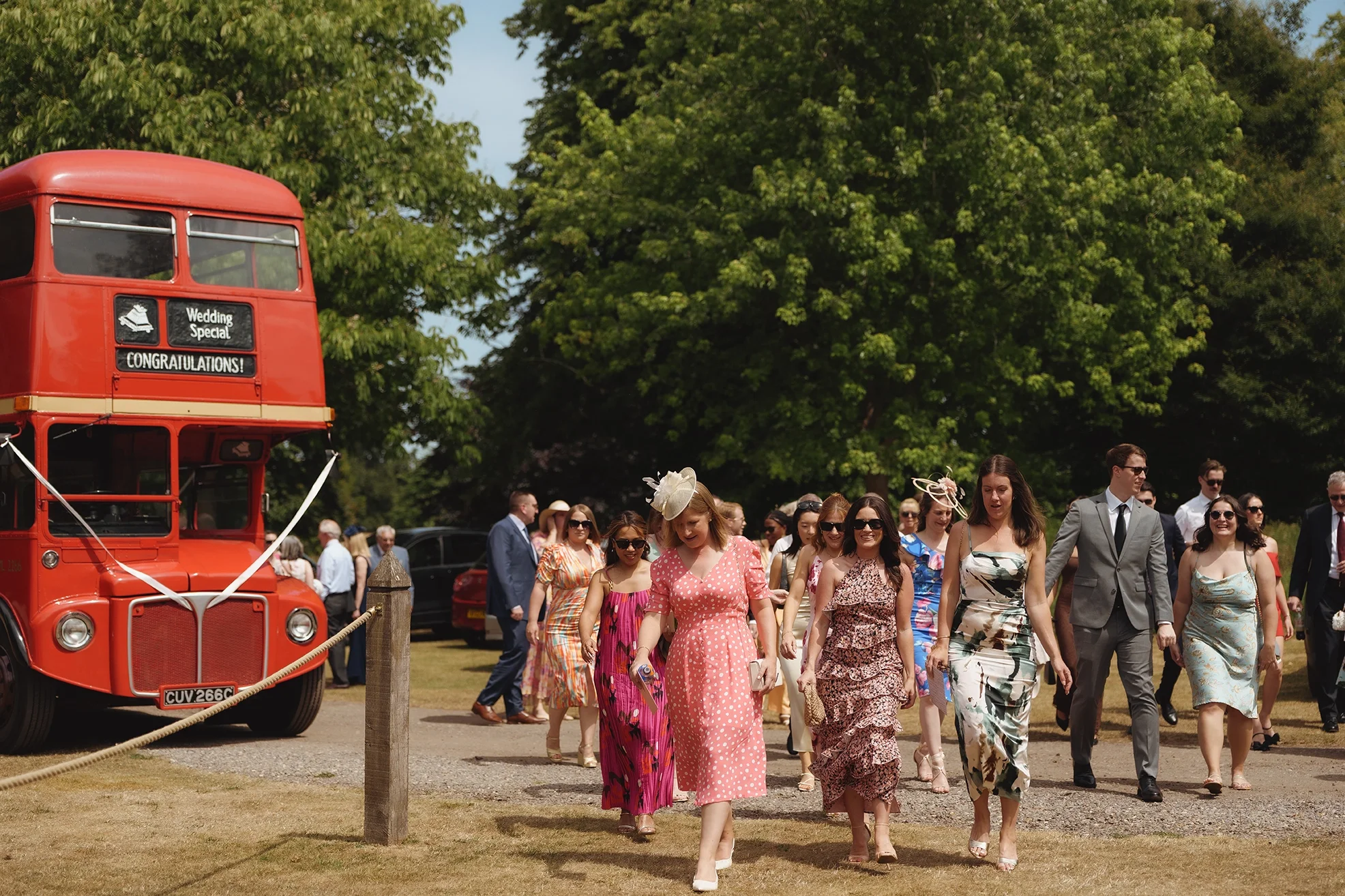 Guests arriving at a wedding from a vintage London bus