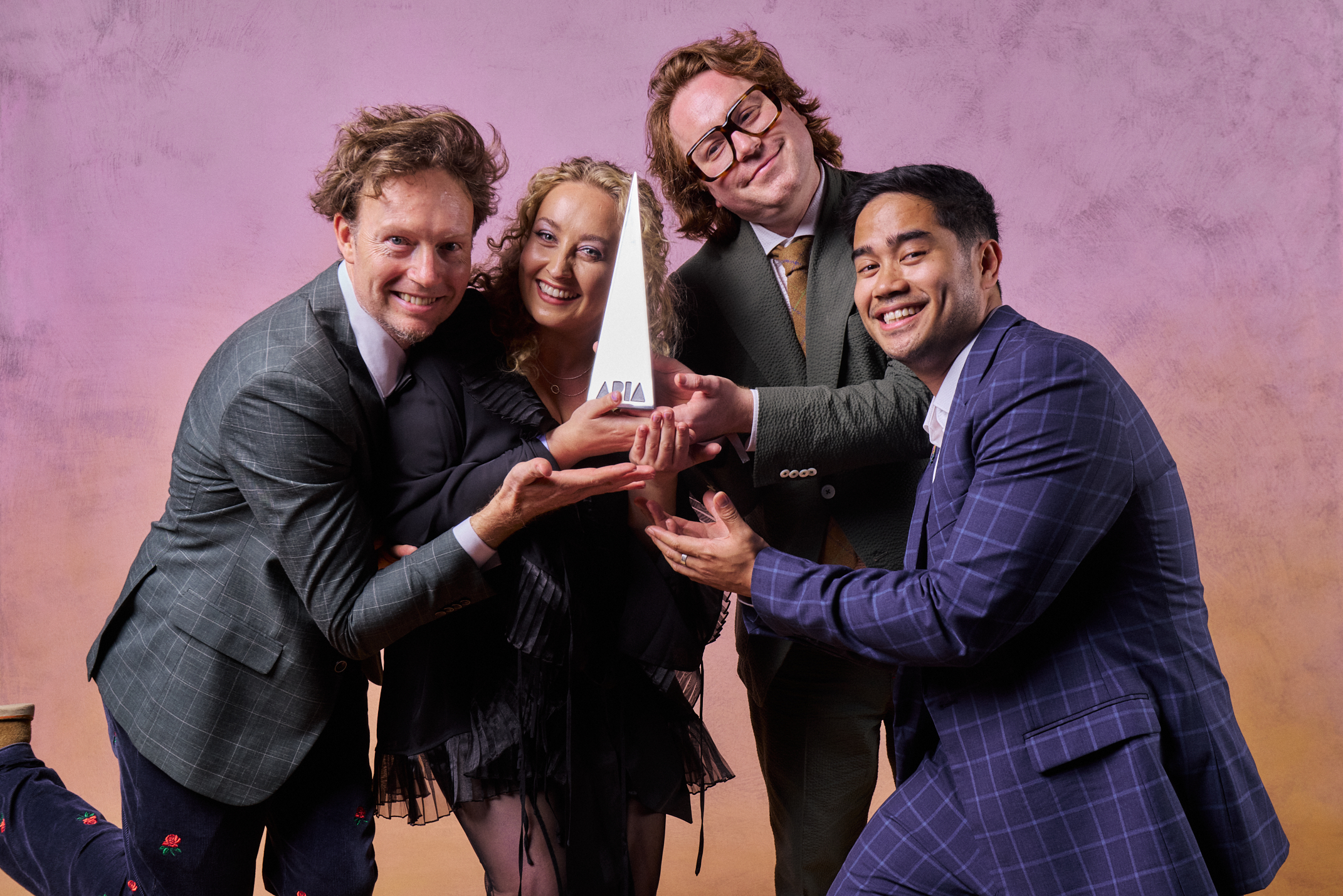 Marly Lüske, Jazz D’Arcy, Joff Bush and Daniel O’Brien of the Bluey music team holding their 2024 ARIA Award for Best Children’s Album for Dance Mode!