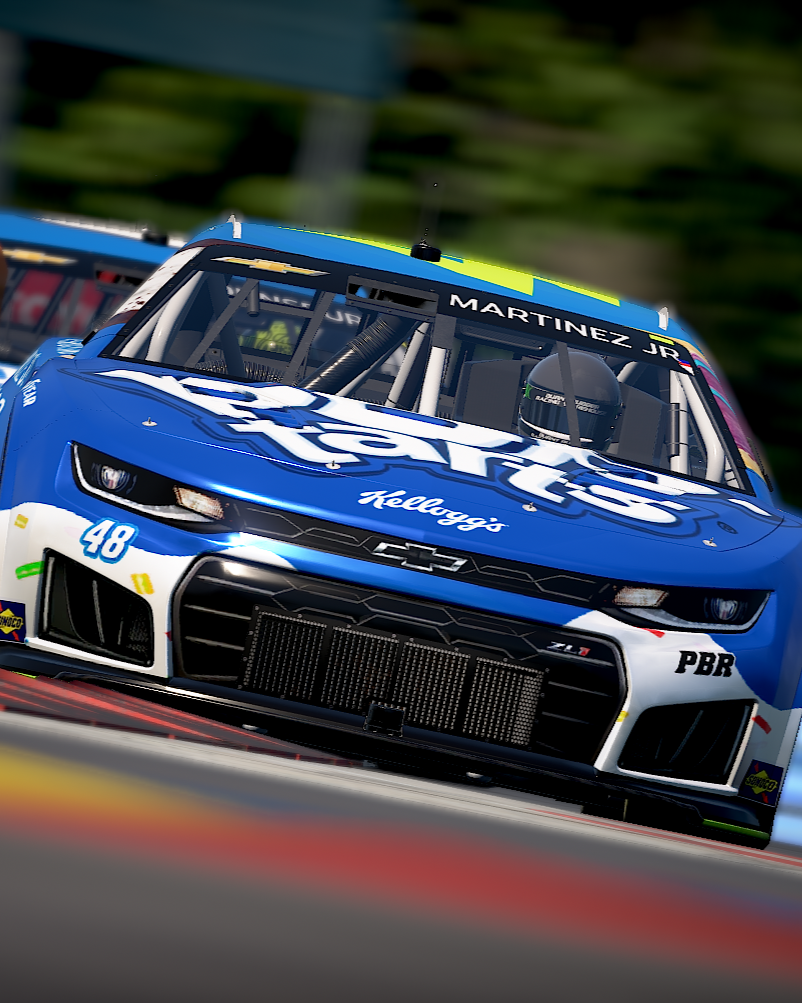 A blue Chevrolet race car with Kellogg's branding and the number 48, driven by Martinez Jr, racing on a track.