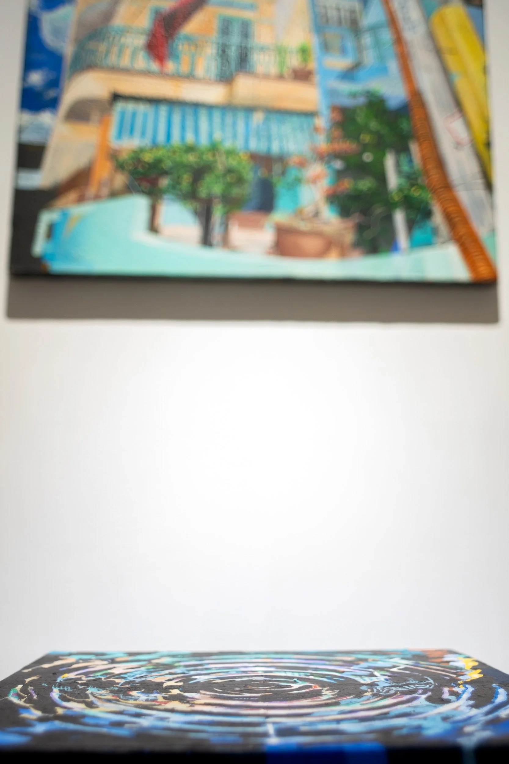 painting of house with another painting of its reflection in water in front