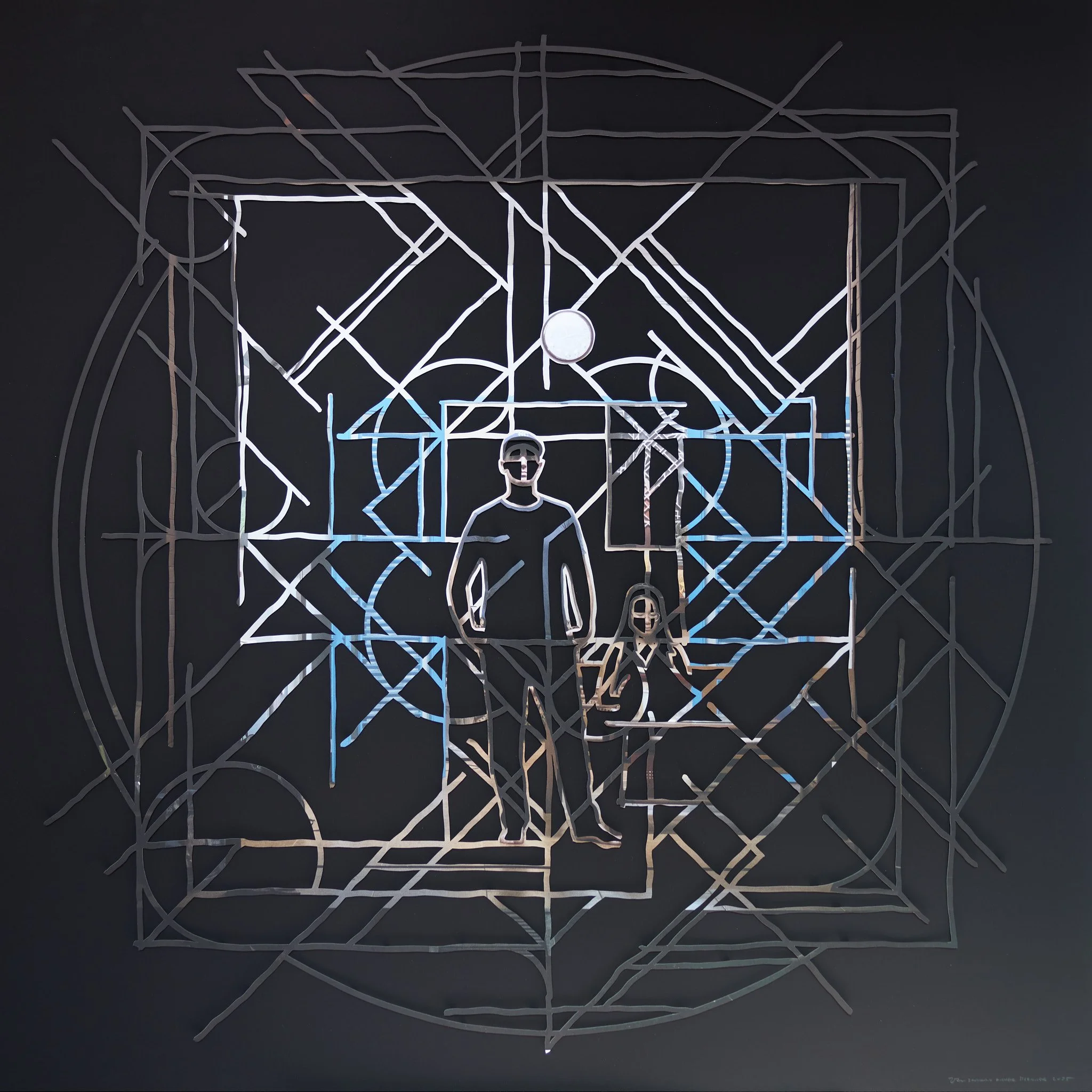 abstract geometric mandala artwork with central figure from cut photograph on a black surface