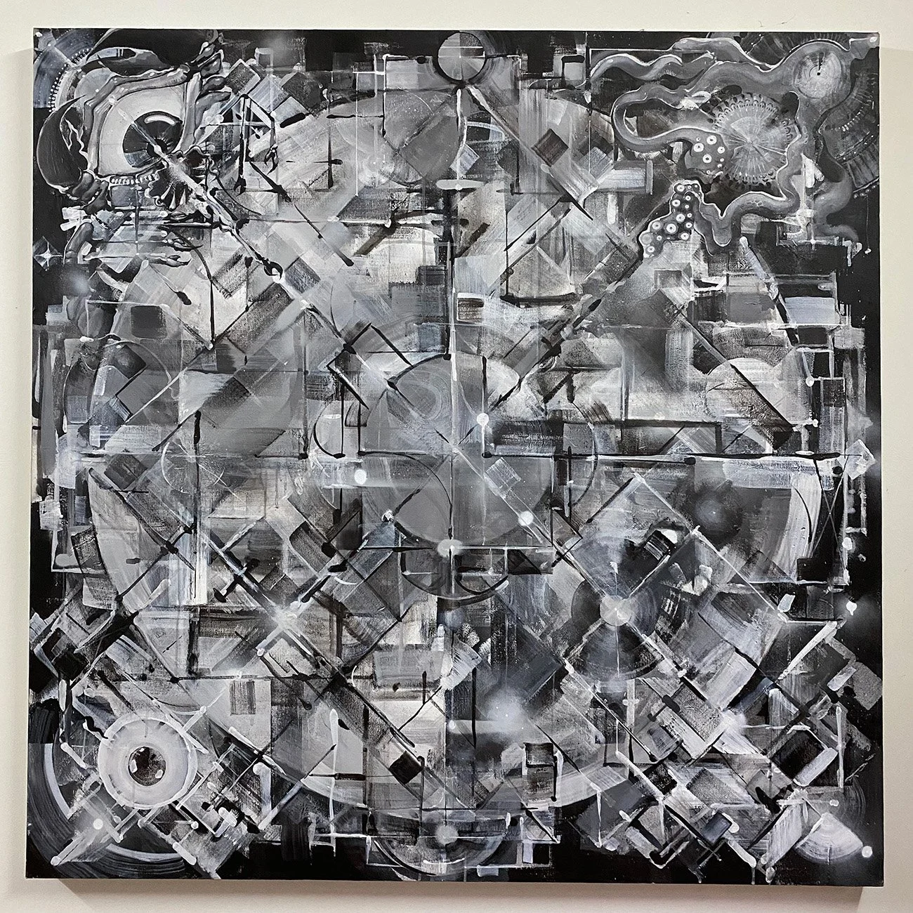 black and white abstract geometric mandala painting with surreal creatures and eyes at the corners
